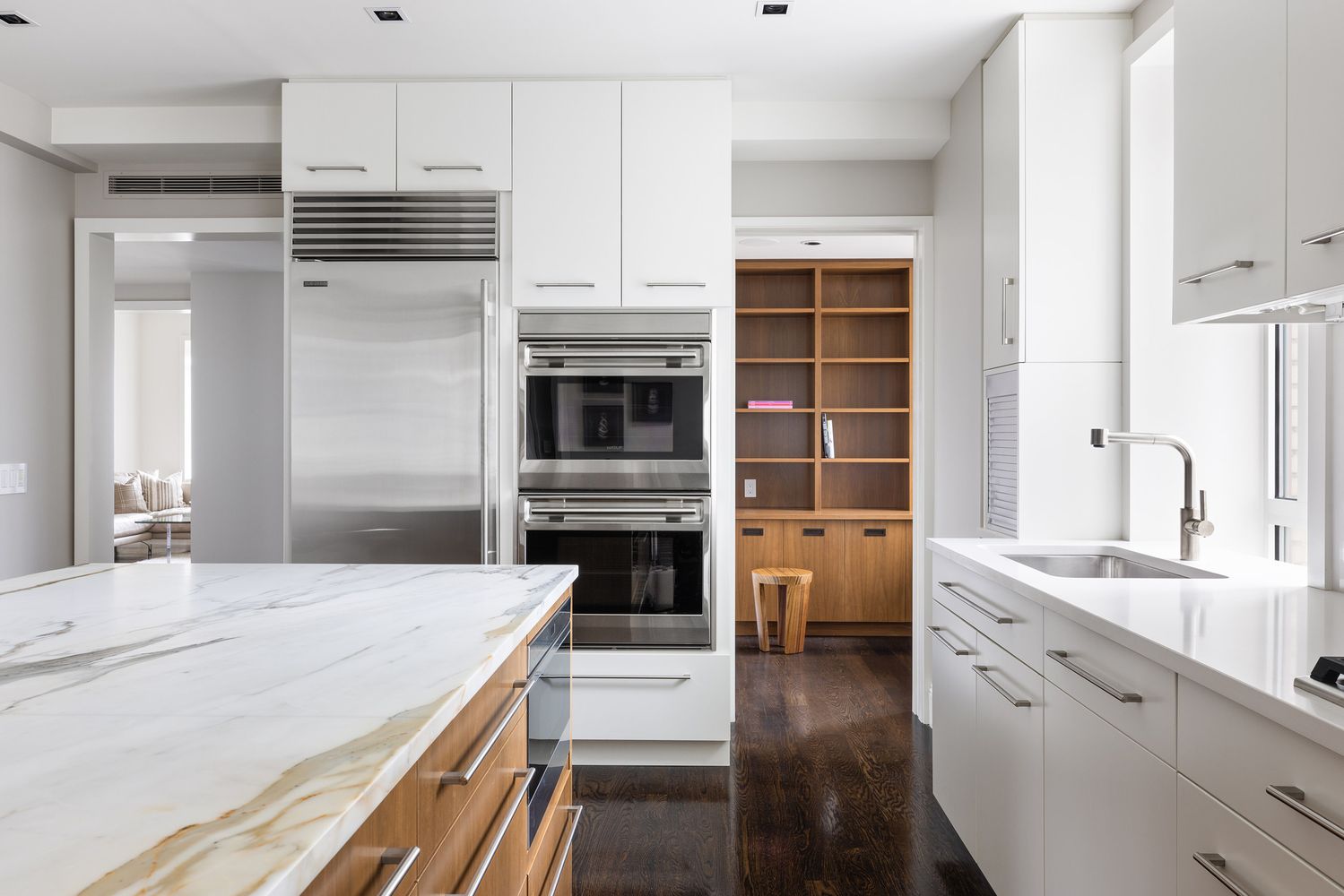 25 Central Park West, Unit 27J Manhattan, NY 10023 - Photo 8 of 13 a kitchen with stainless steel appliances a stove sink and cabinets