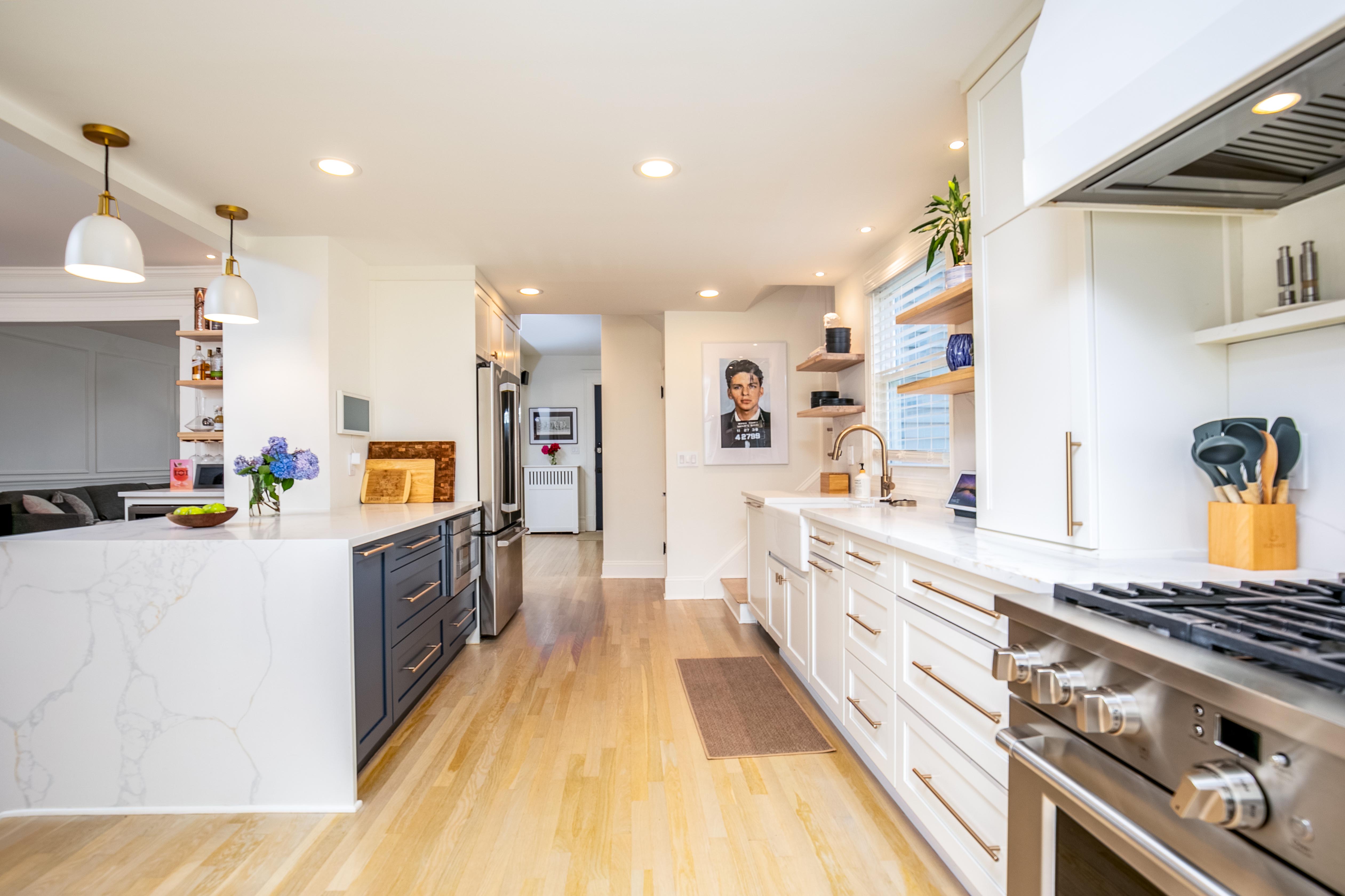 163 Ridge Road Rutherford, NJ 07070 - Photo 19 of 59 a large kitchen with stainless steel appliances a stove a sink a refrigerator and a cabinets