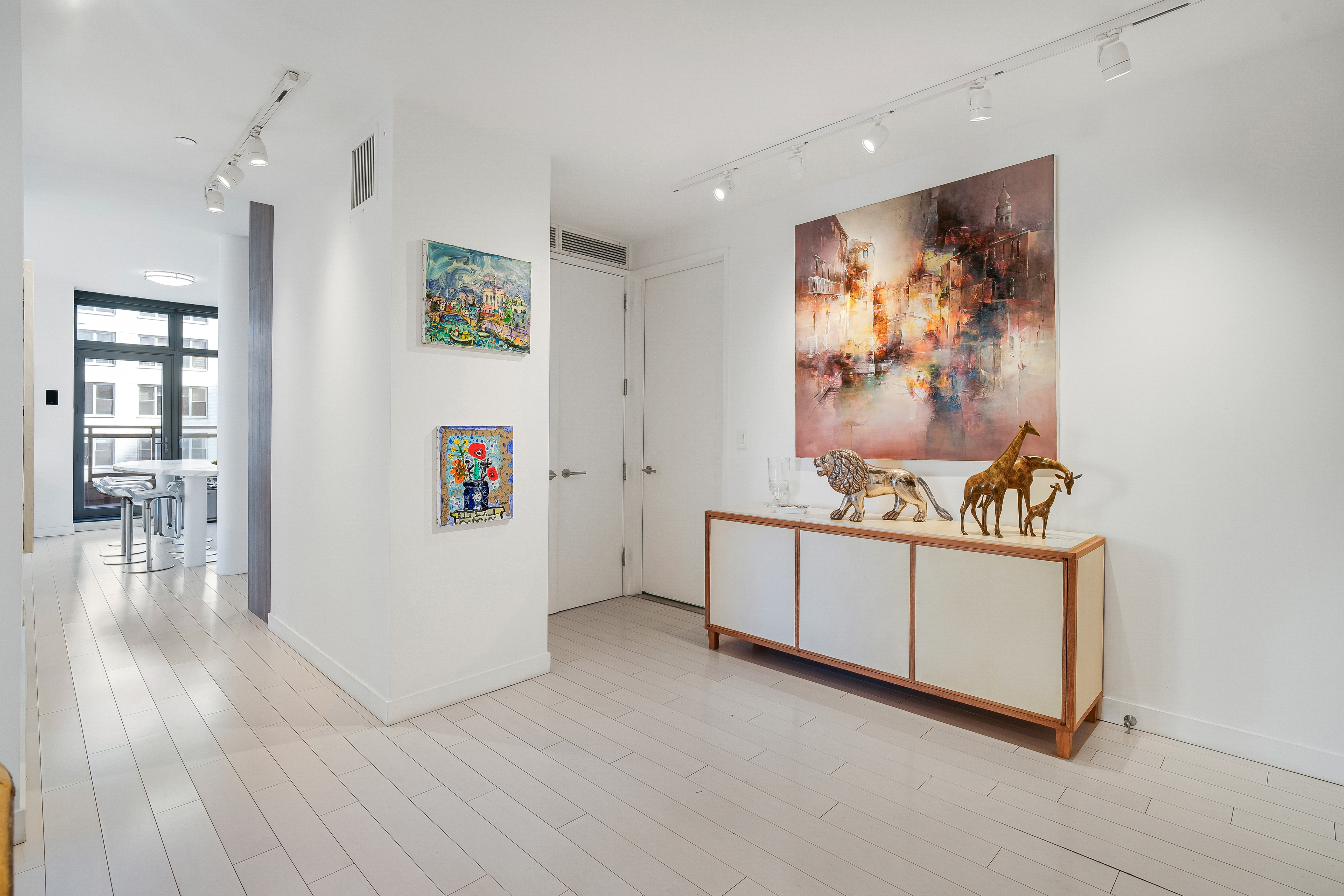 450 East 83rd Street, Unit 6B Manhattan, NY 10028 - Photo 5 of 25 a room with furniture and wooden floor