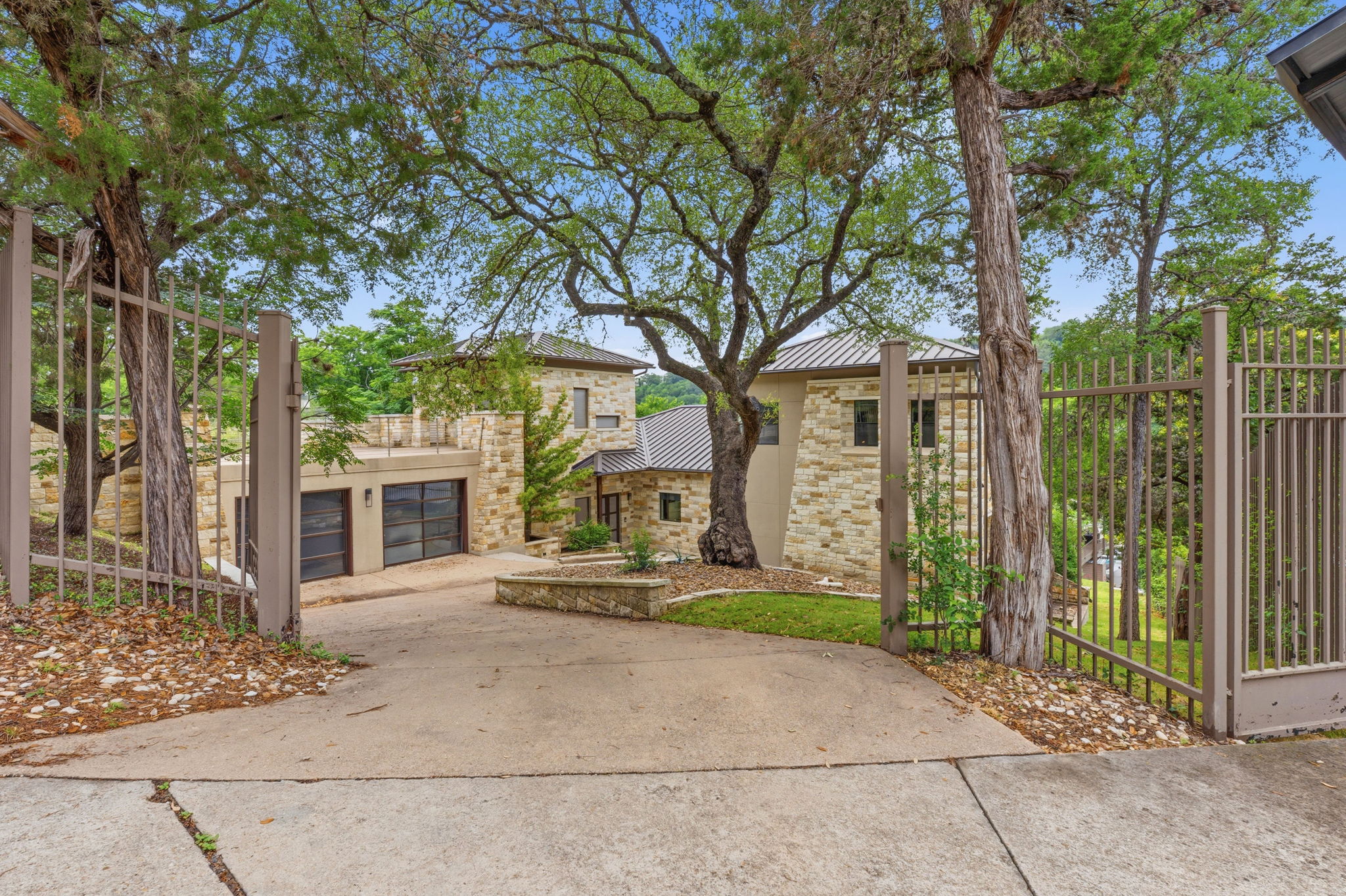 3605 Robbins Road Austin, TX 78730 - Photo 9 of 51 a front view of a house with a garden