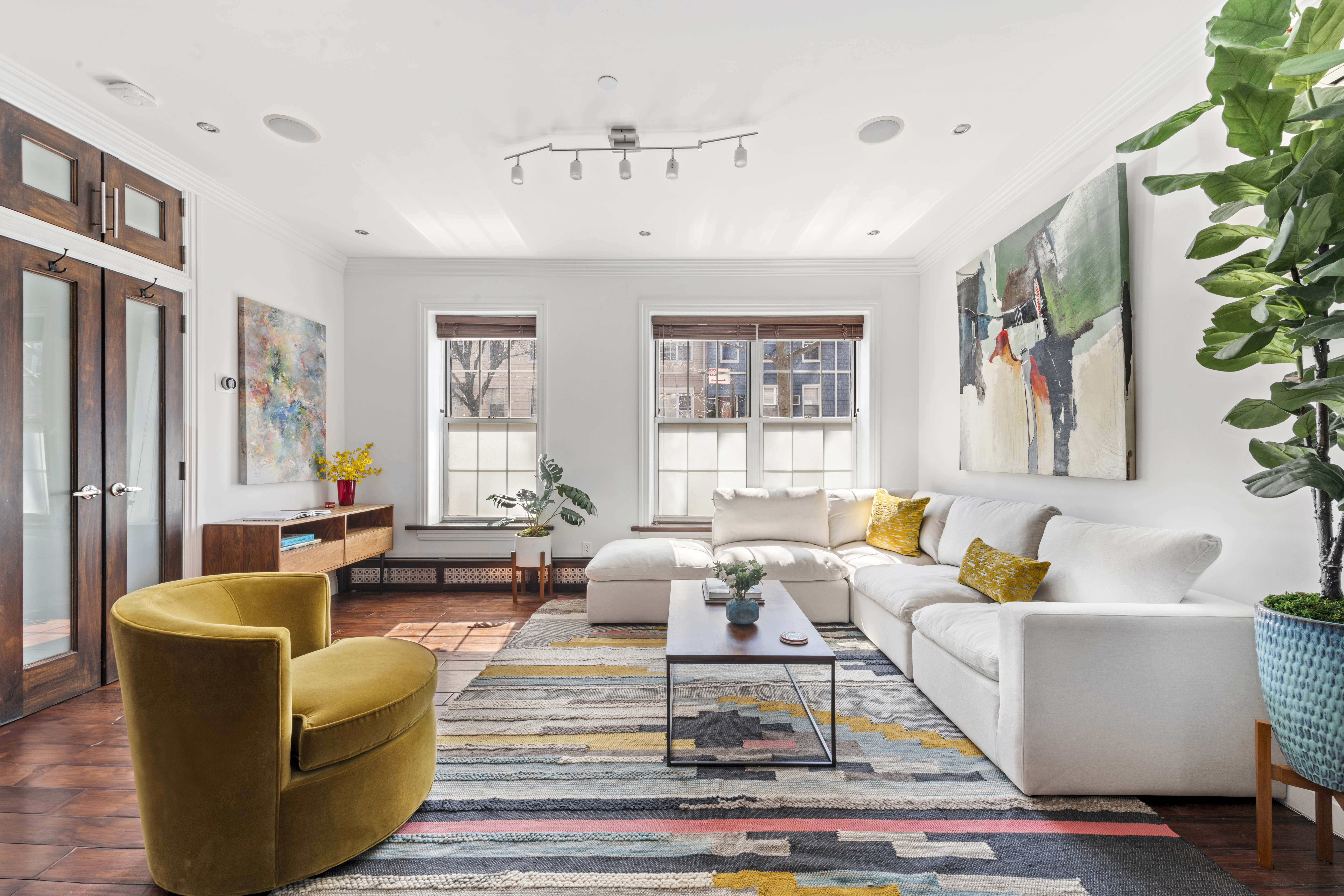 a living room with furniture or couch and a potted plant