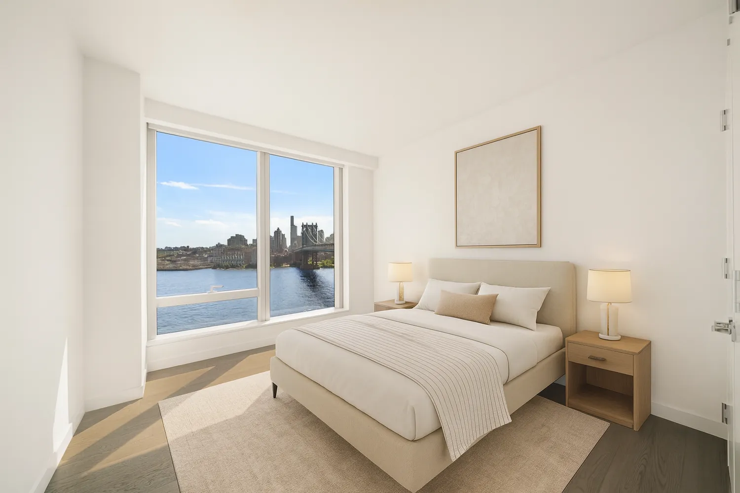 a bedroom with a bed and a large window