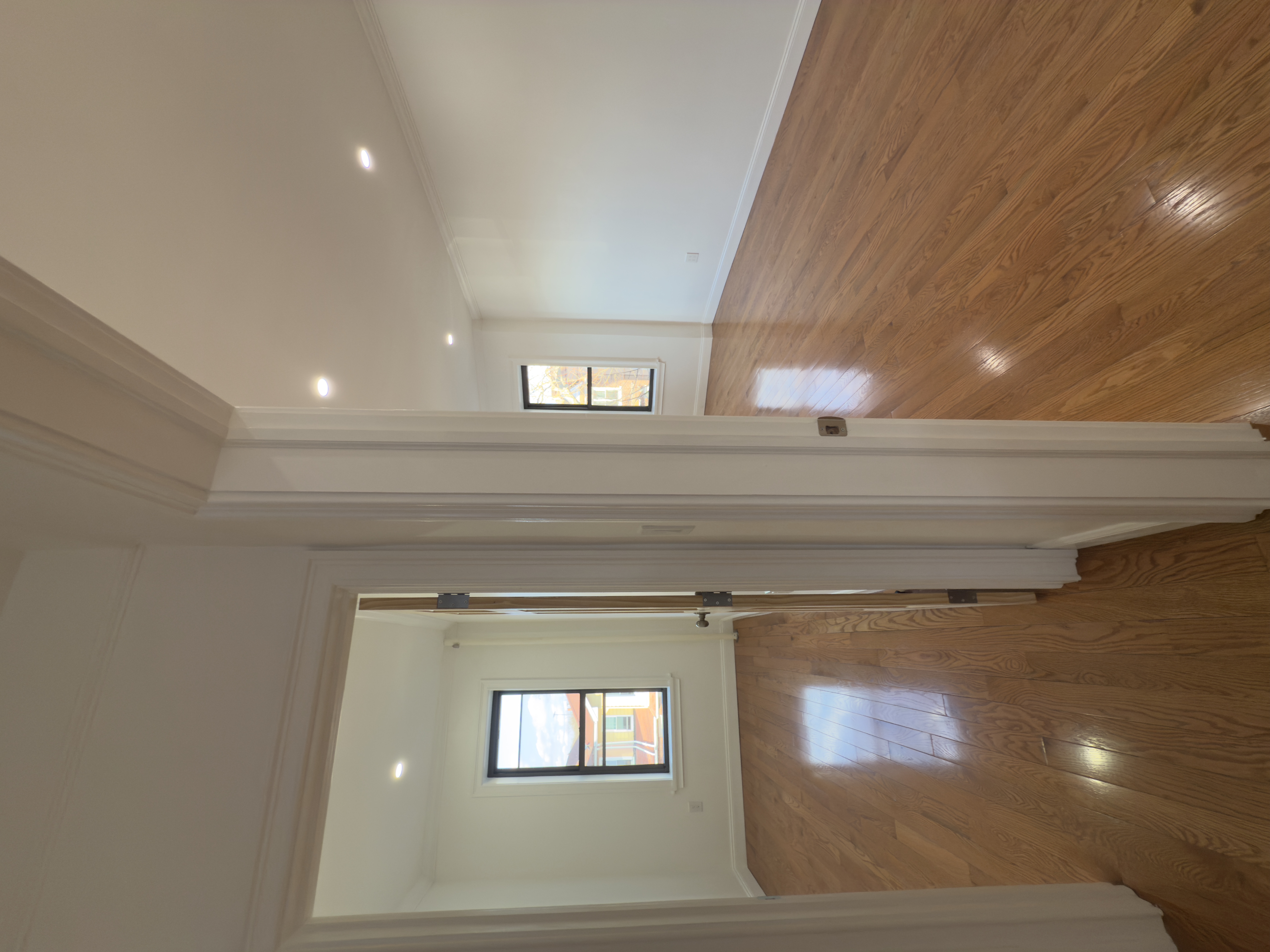 82 74th Street Brooklyn, NY 11209 - Photo 17 of 21 a view of hallway with wooden floor and window