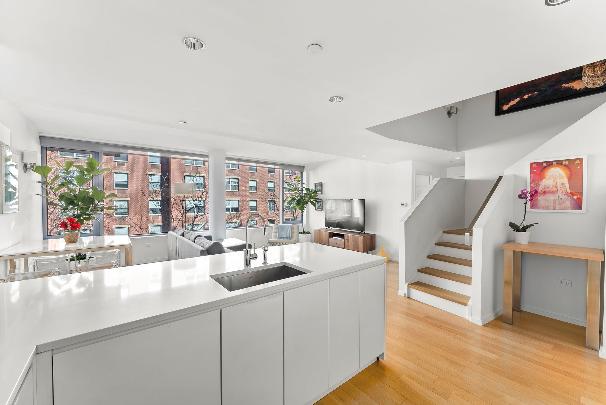 425 West 53rd Street, Unit 416 Manhattan, NY 10019 - Photo 2 of 19 a view of living room with furniture and window