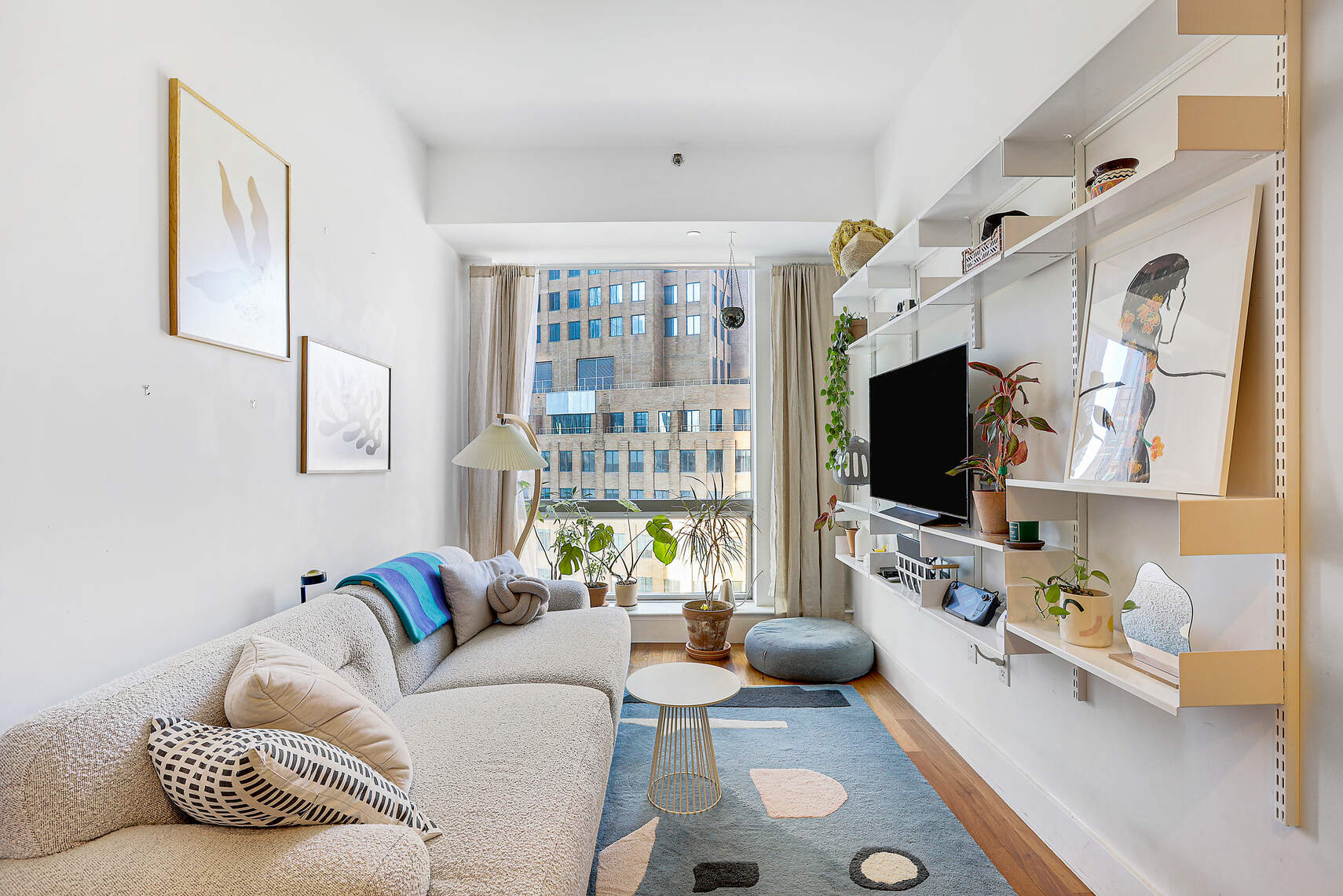 150 Myrtle Avenue, Unit 1105 Brooklyn, NY 11201 - Photo 1 of 24 a living room with furniture and a flat screen tv
