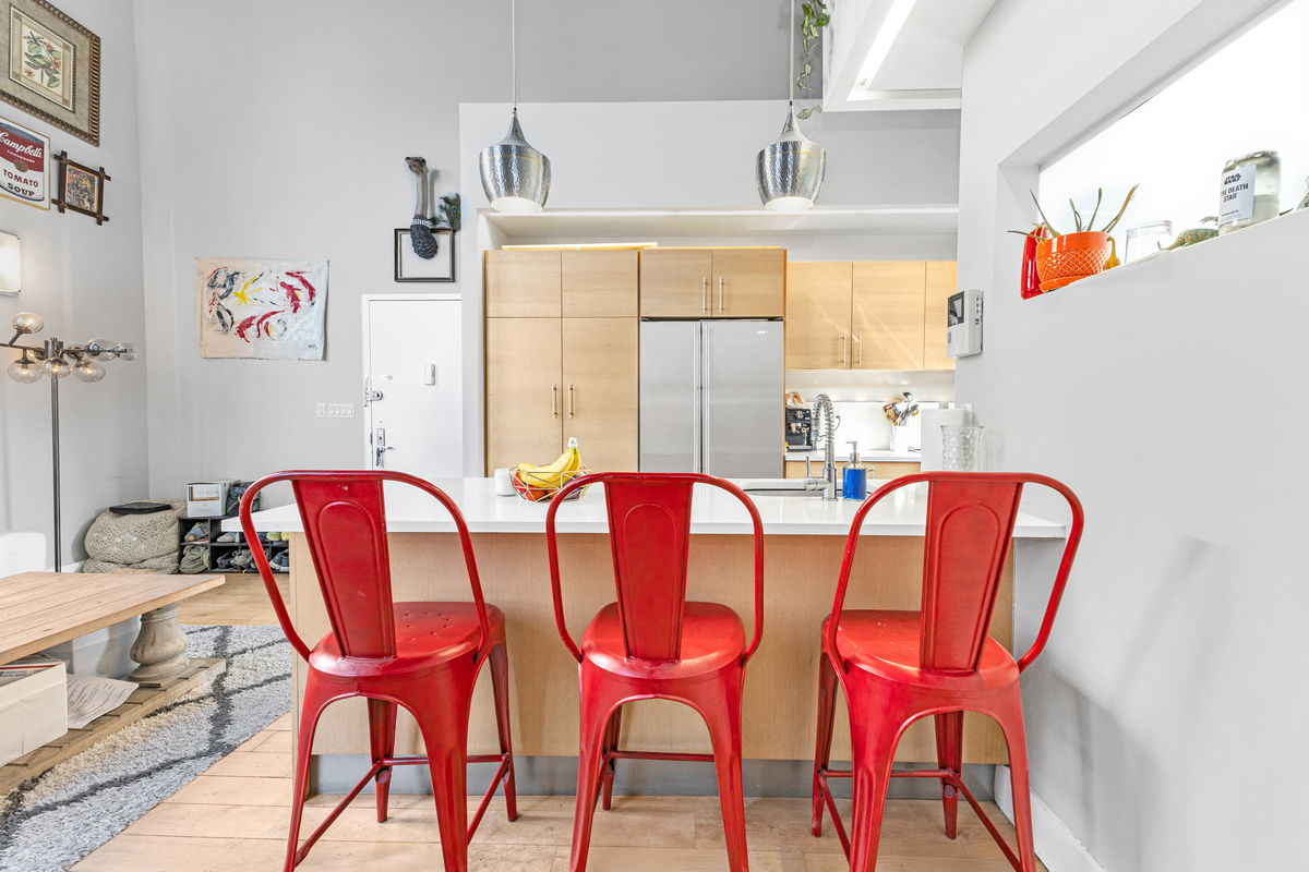 96 Woodpoint Road, Unit 3A Brooklyn, NY 11211 - Photo 7 of 15 a view of a dining room with furniture and a kitchen