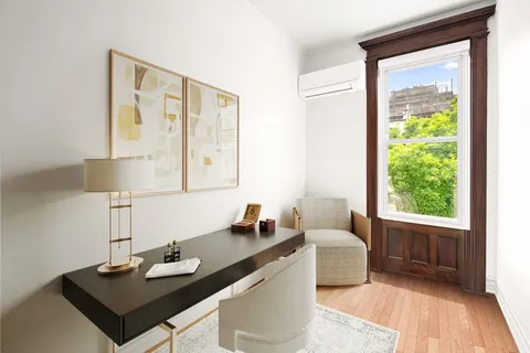 a bathroom with a granite countertop sink and a bathtub