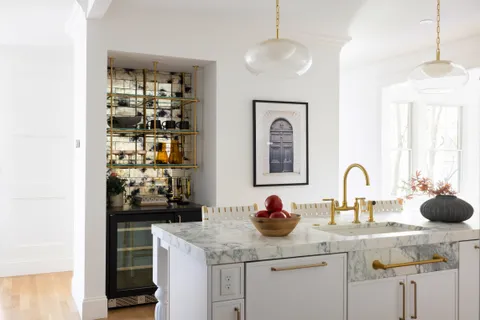 a kitchen with a sink and cabinets