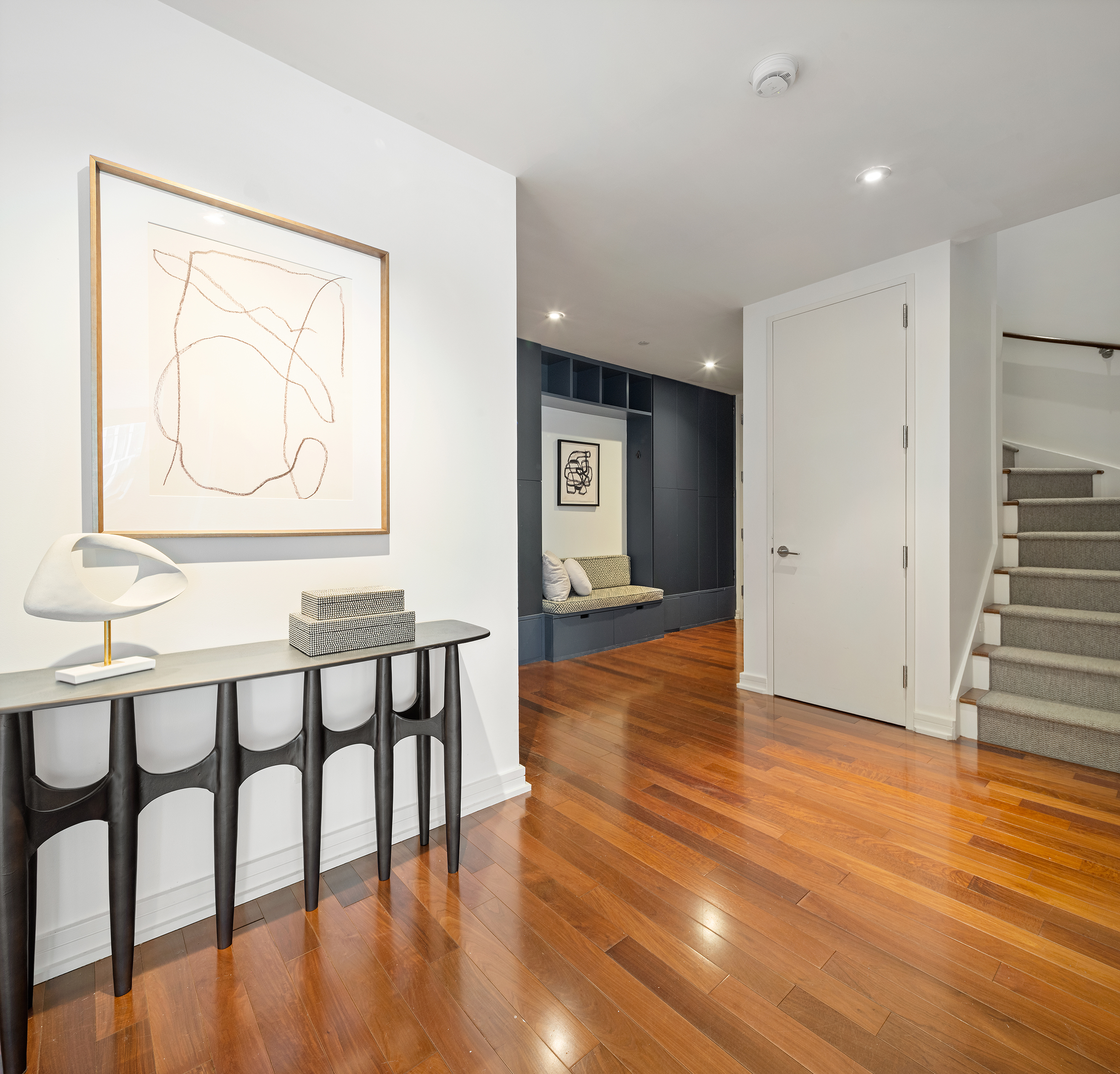 101 Warren Street, Unit 11L Manhattan, NY 10007 - Photo 11 of 28 an entryway with wooden floor and door