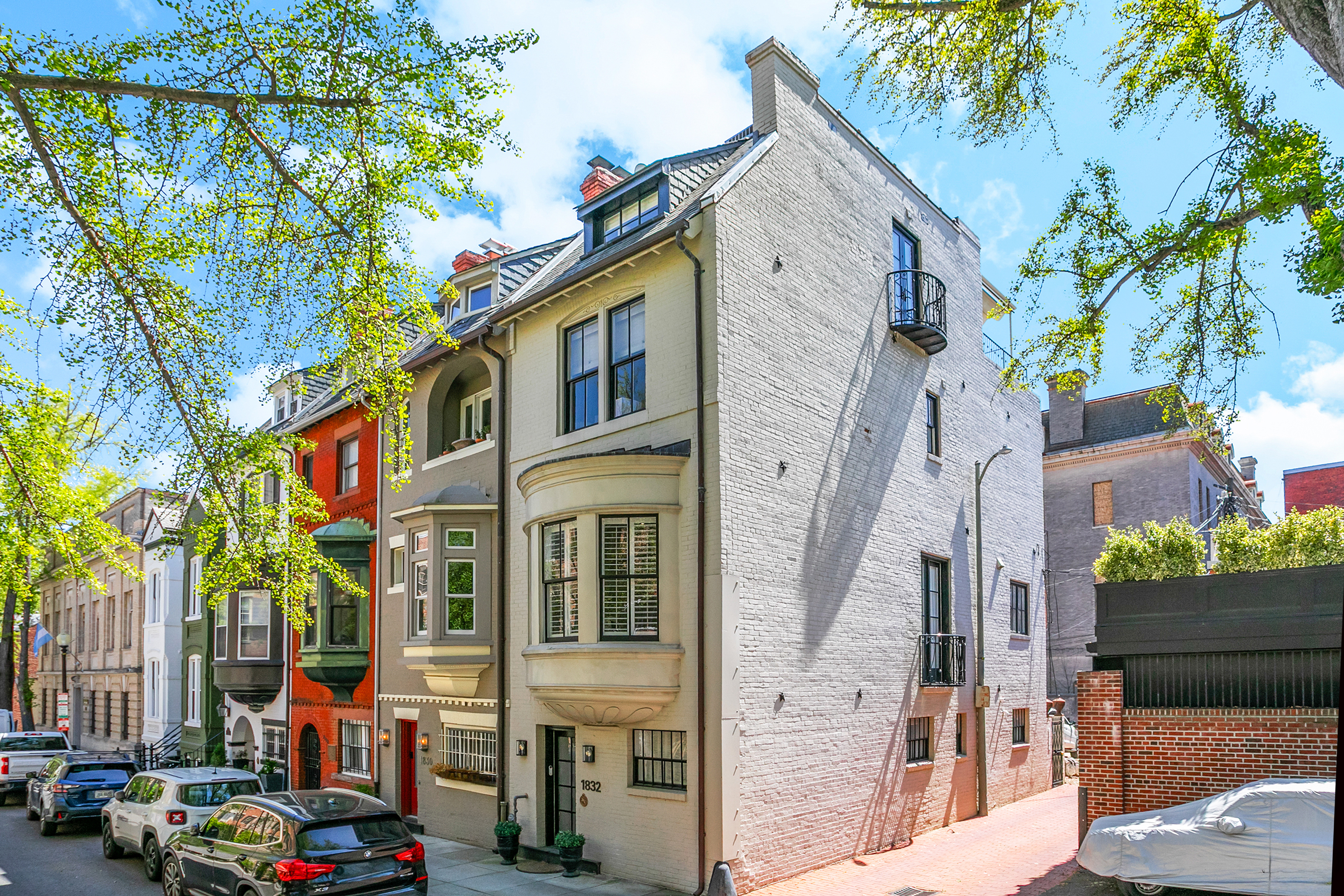 a city street lined with buildings and cars