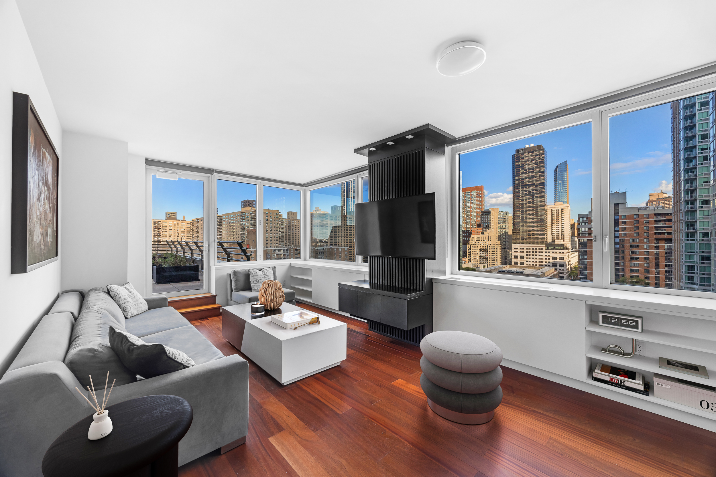 100 Riverside Boulevard, Unit 21A Manhattan, NY 10069 - Photo 4 of 22 a living room with furniture and a large window