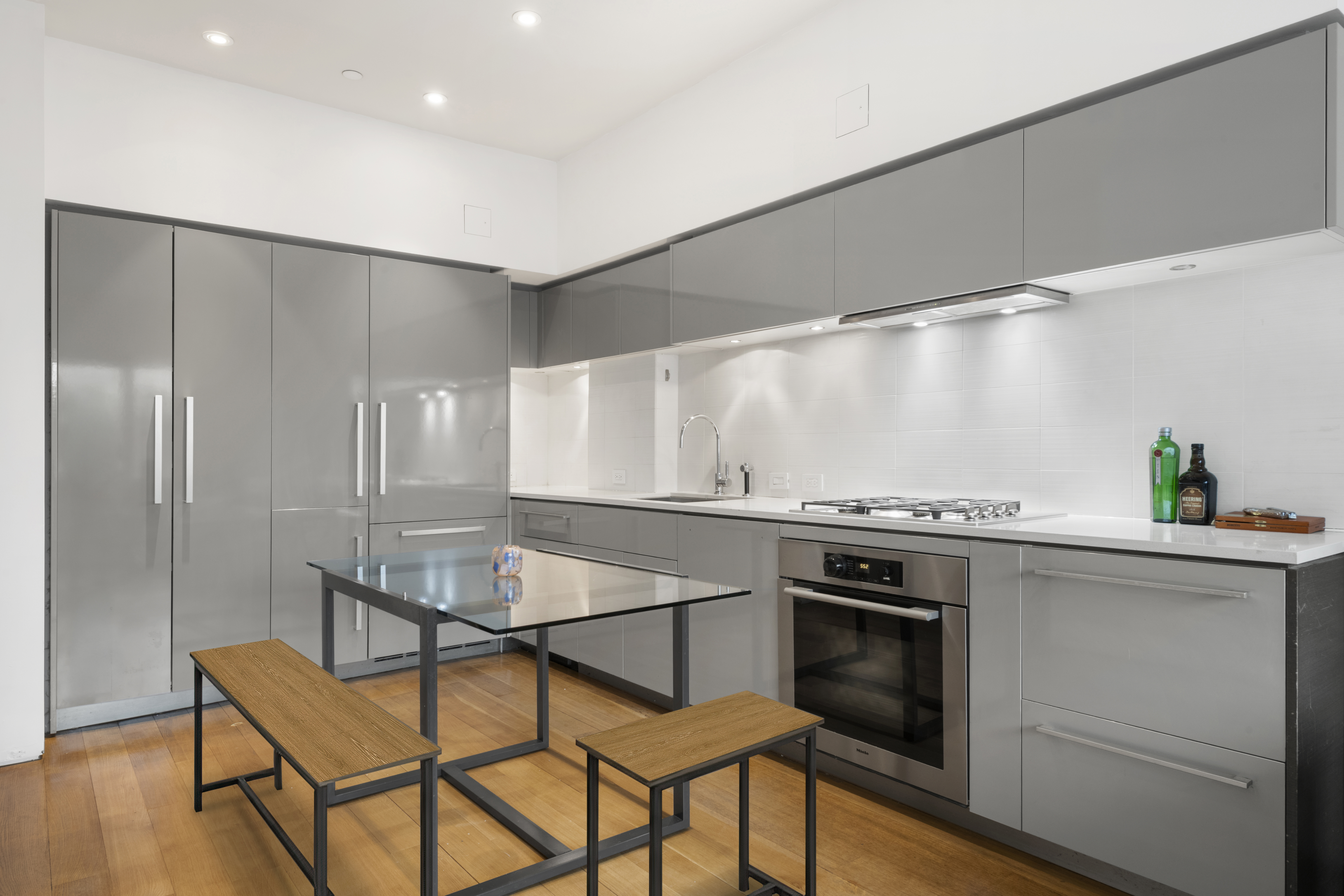123 3rd Avenue, Unit 5D Manhattan, NY 10003 - Photo 2 of 12 a kitchen with a stove a sink and a refrigerator