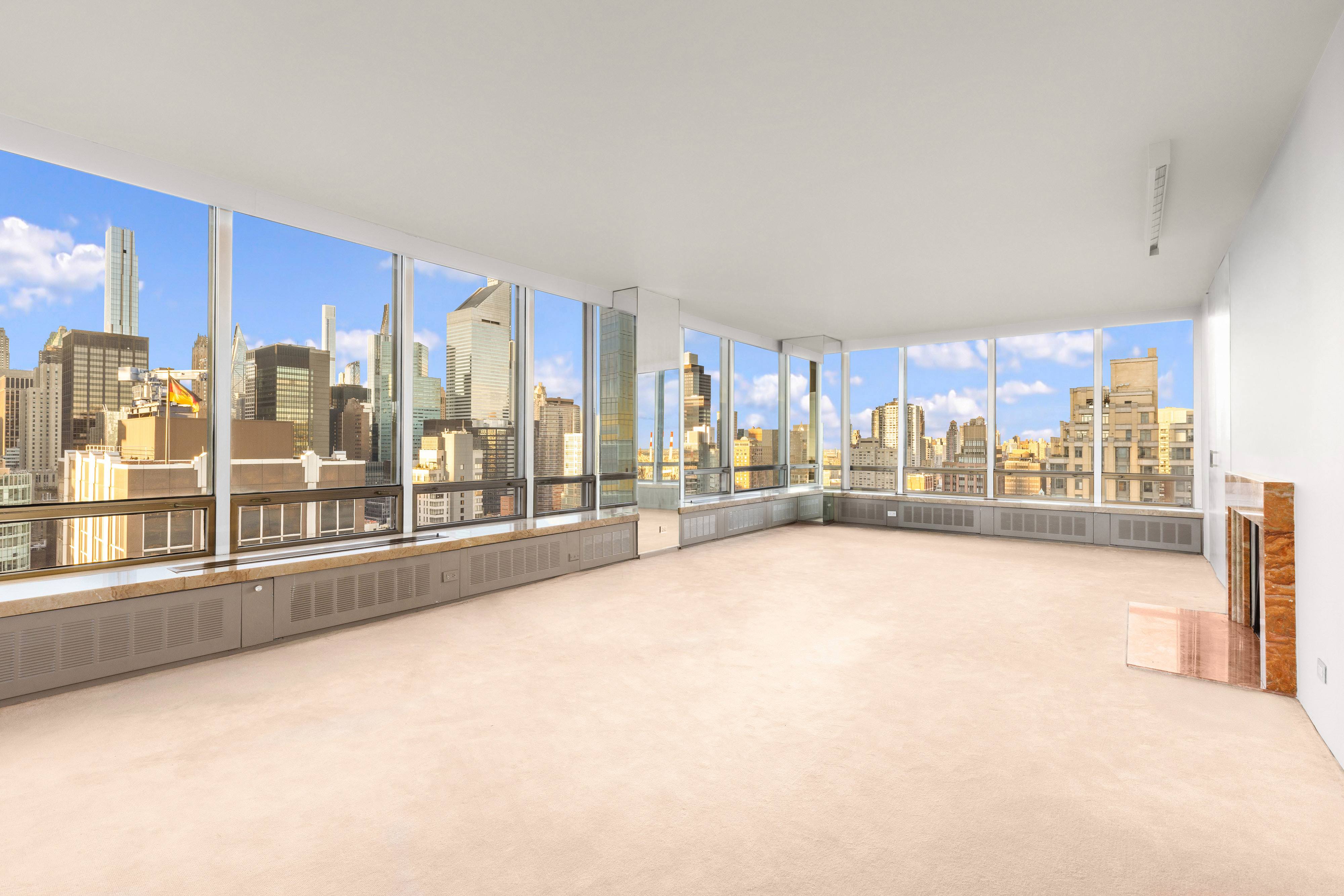 860 United Nations Plaza, Unit 36D Manhattan, NY 10017 - Photo 2 of 21 a view of an empty room with a fireplace