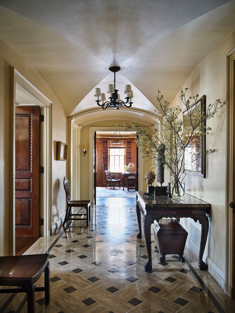 a living room with furniture a fireplace and a table