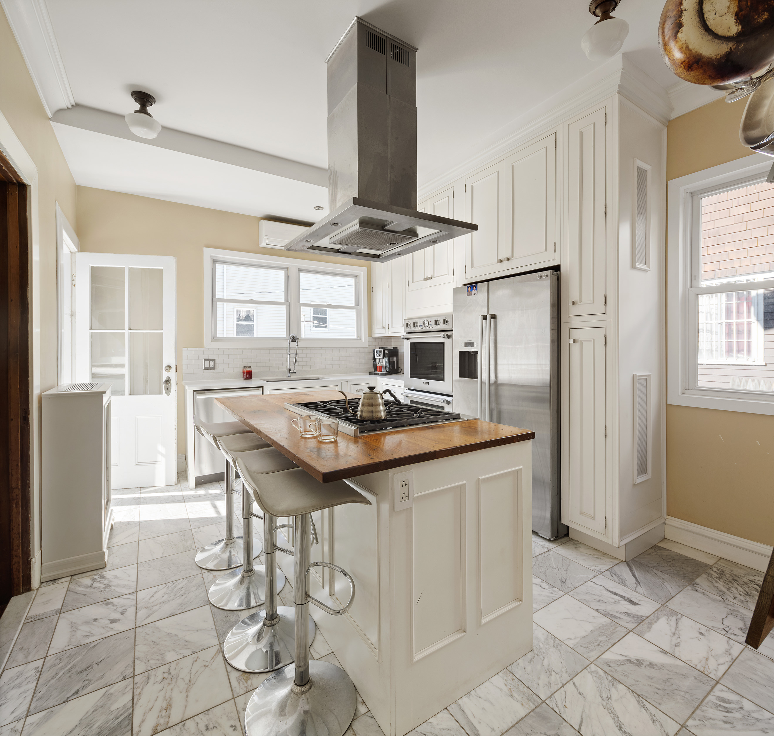 462 Westminster Road Brooklyn, NY 11218 - Photo 5 of 18 a kitchen with stainless steel appliances granite countertop a stove refrigerator and cabinets
