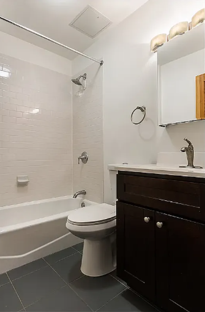 406 Monroe Street, Unit 3 Brooklyn, NY 11221 - Photo 6 of 11 a bathroom with a sink toilet and shower