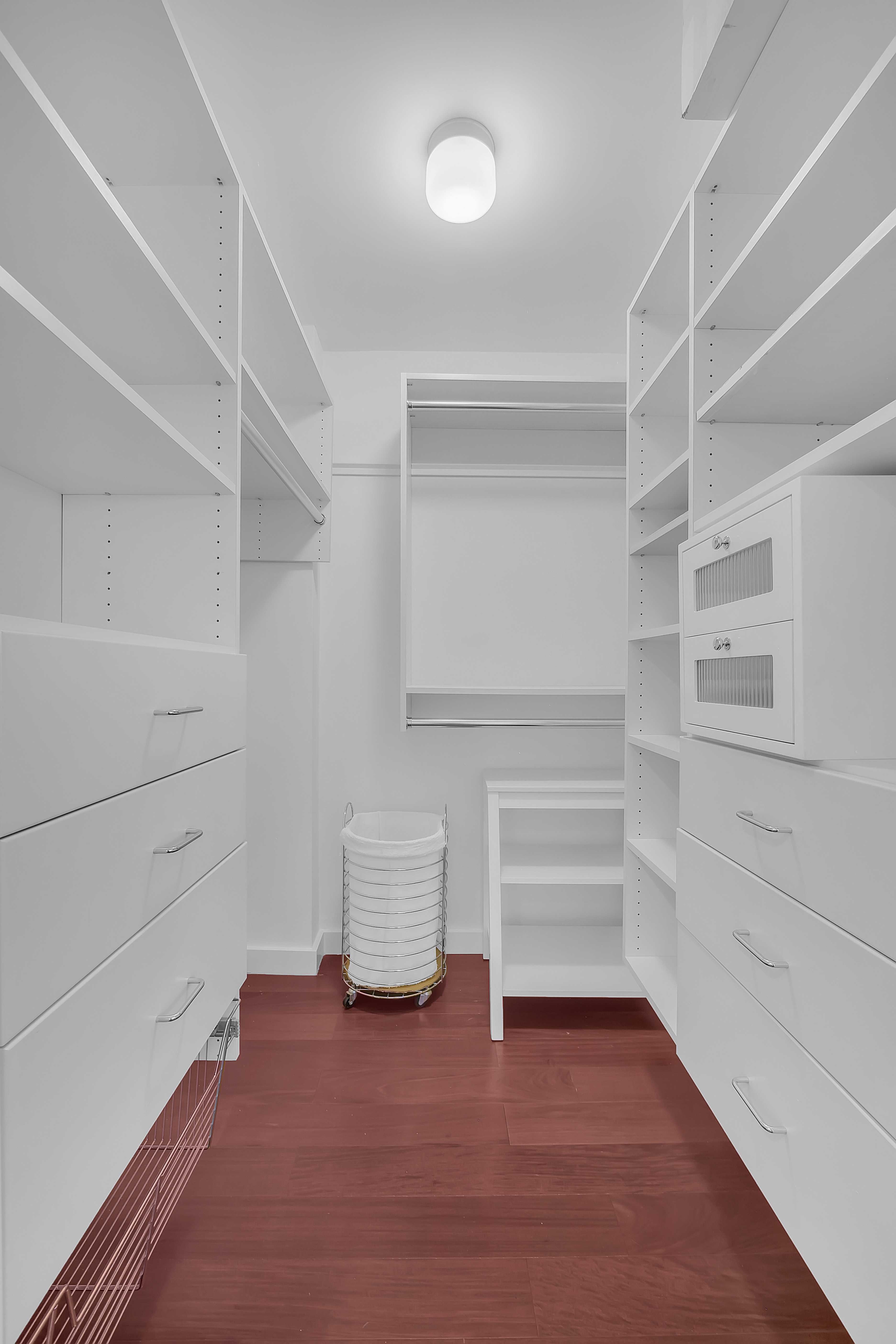 1485 5th Avenue, Unit 18/19H Manhattan, NY 10035 - Photo 12 of 24 a view of an empty walk in closet