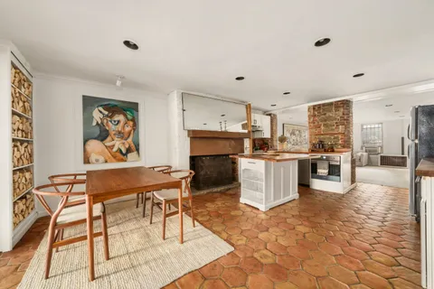 a living room with stainless steel appliances kitchen island granite countertop furniture and a kitchen view