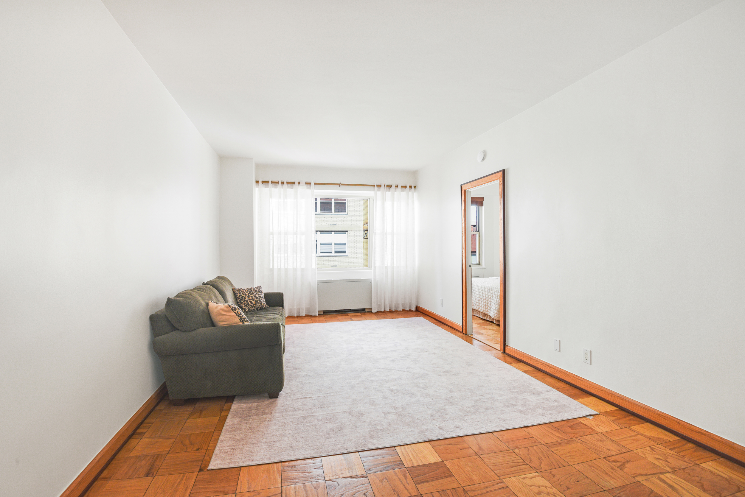 520 East 72nd Street, Unit 10P Manhattan, NY 10021 - Photo 5 of 13 a living room with furniture and a rug