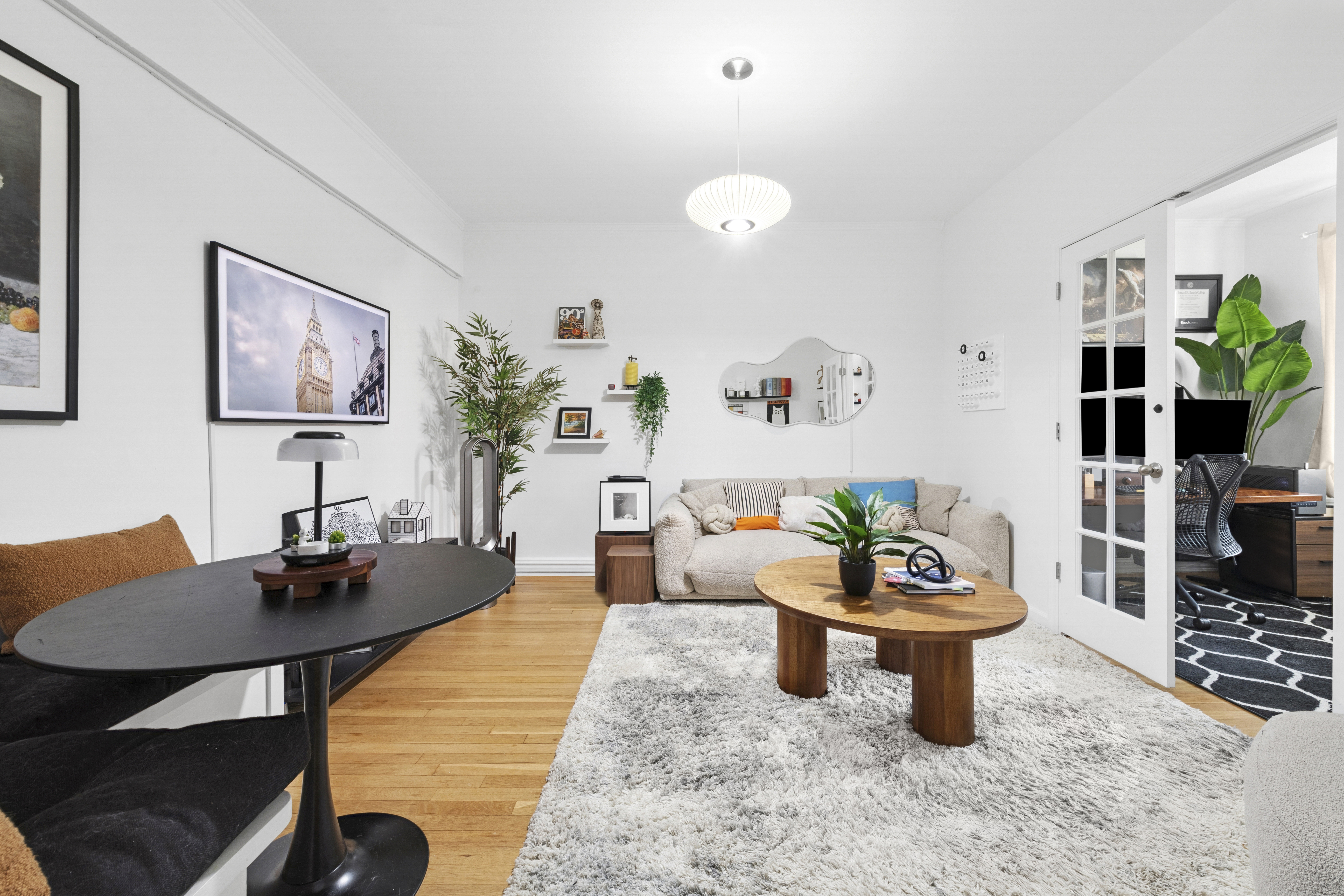 140 East 2nd Street, Unit 5F Brooklyn, NY 11218 - Photo 4 of 7 a living room with furniture and flowers