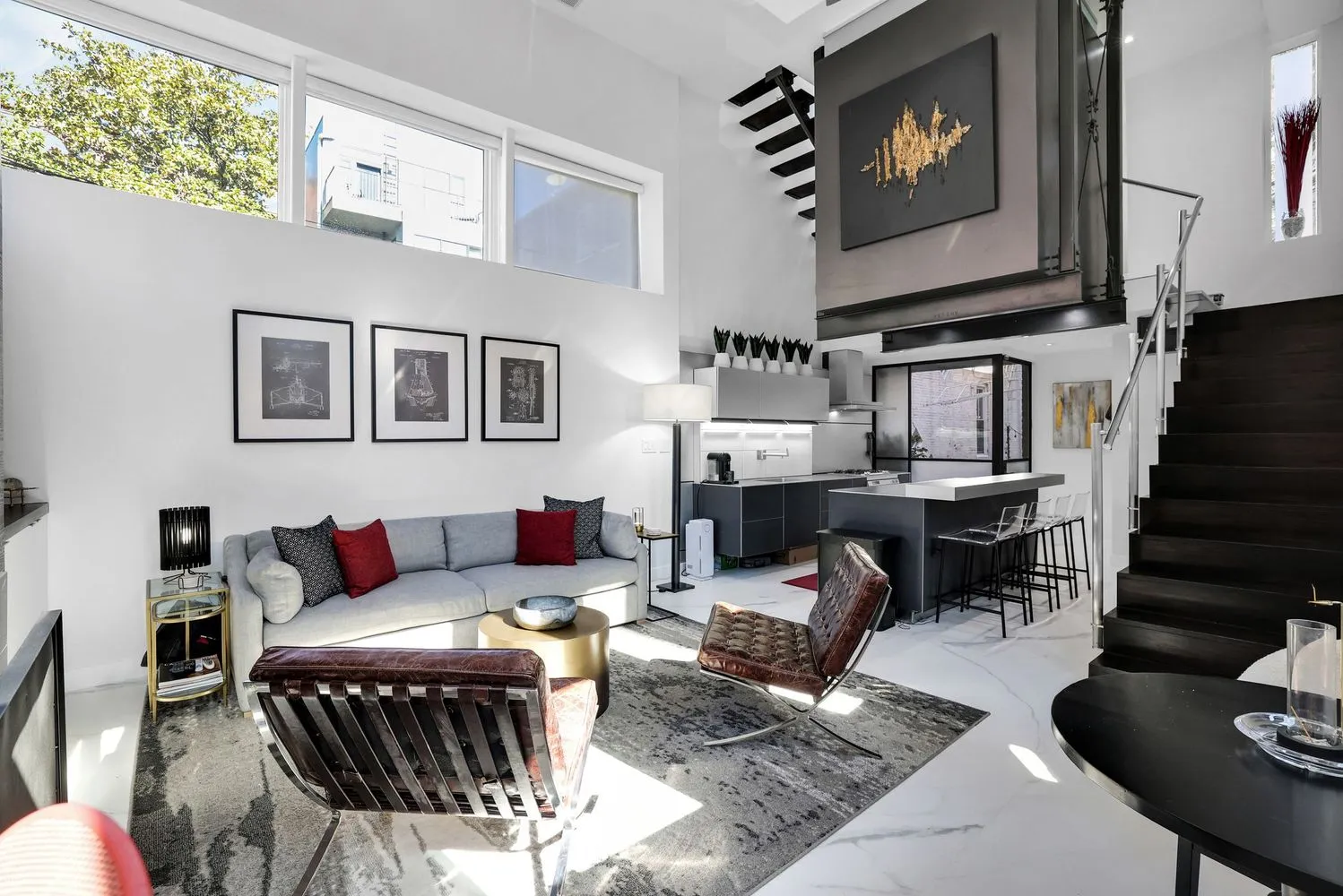 a living room with furniture a rug and a fireplace