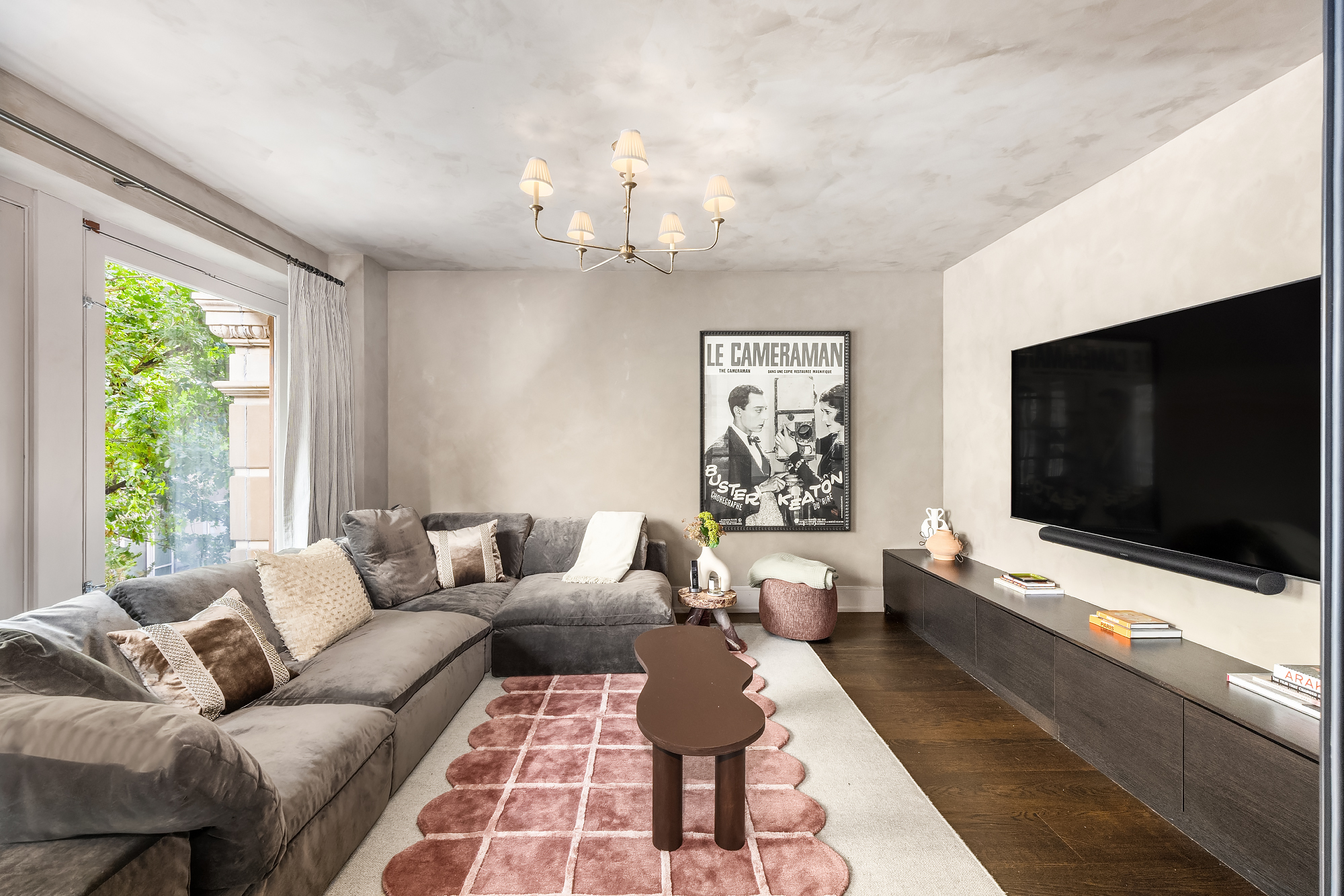 14-16 Wooster Street, Unit 2 Manhattan, NY 10013 - Photo 9 of 22 a living room with furniture and a flat screen tv