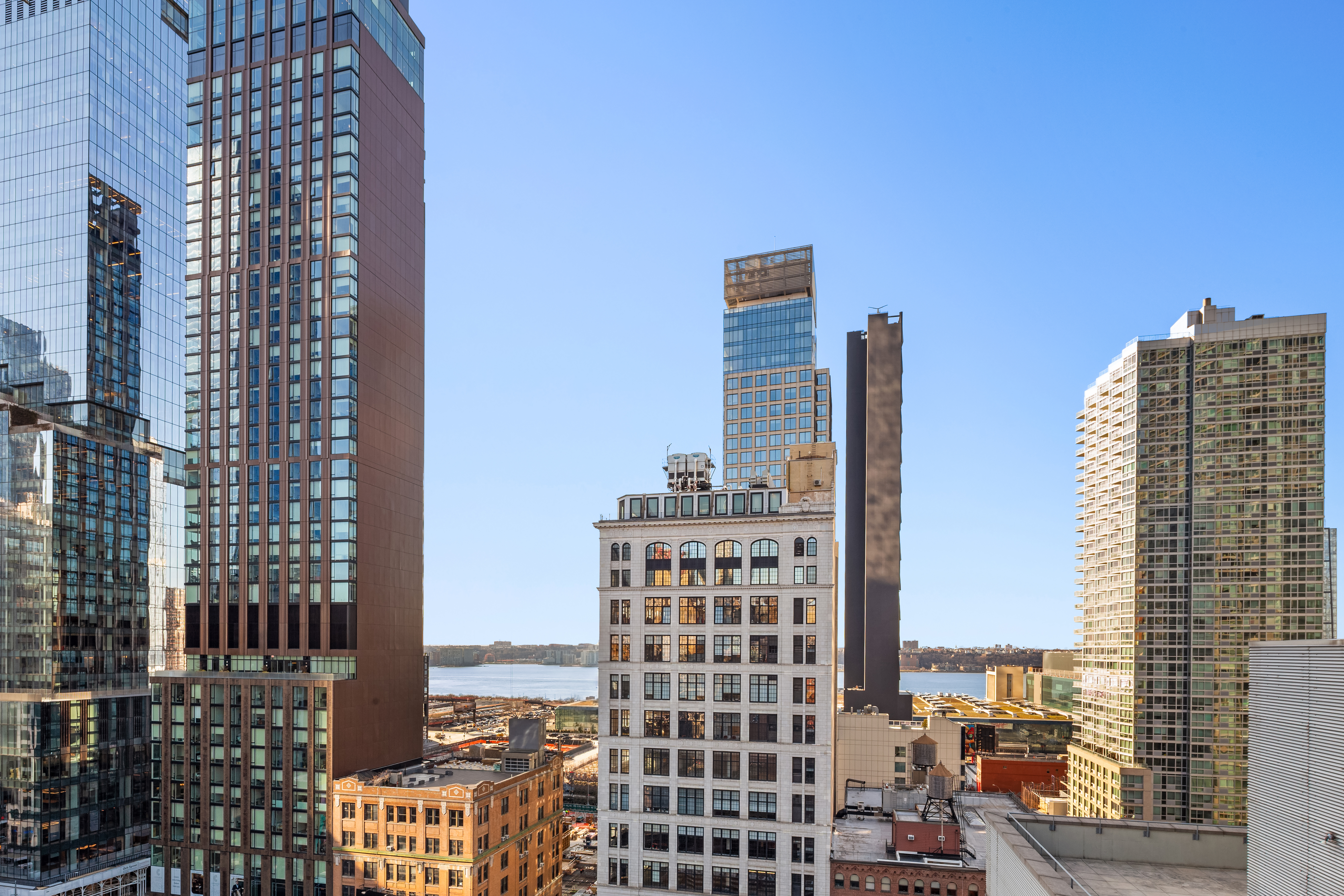 448 West 37th Street, Unit 11G/12G Manhattan, NY 10018 - Photo 15 of 17 a city view with tall buildings