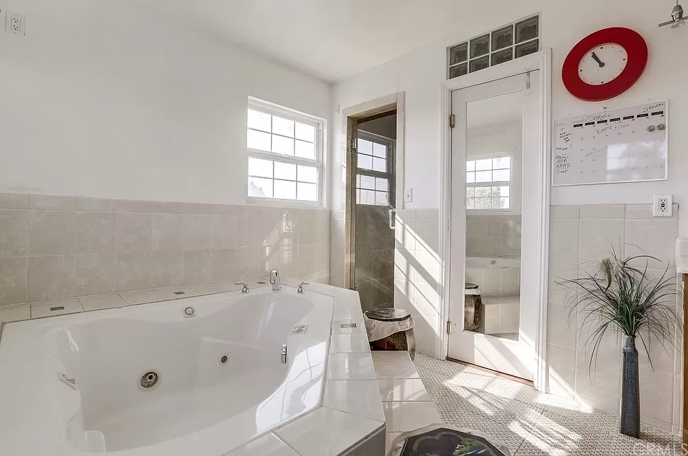 15604 Deblynn Avenue Gardena, CA 90248 - Photo 17 of 22 a bathroom with a tub a sink and a window