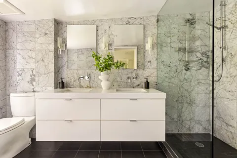 a spacious bedroom with a bed and a couch