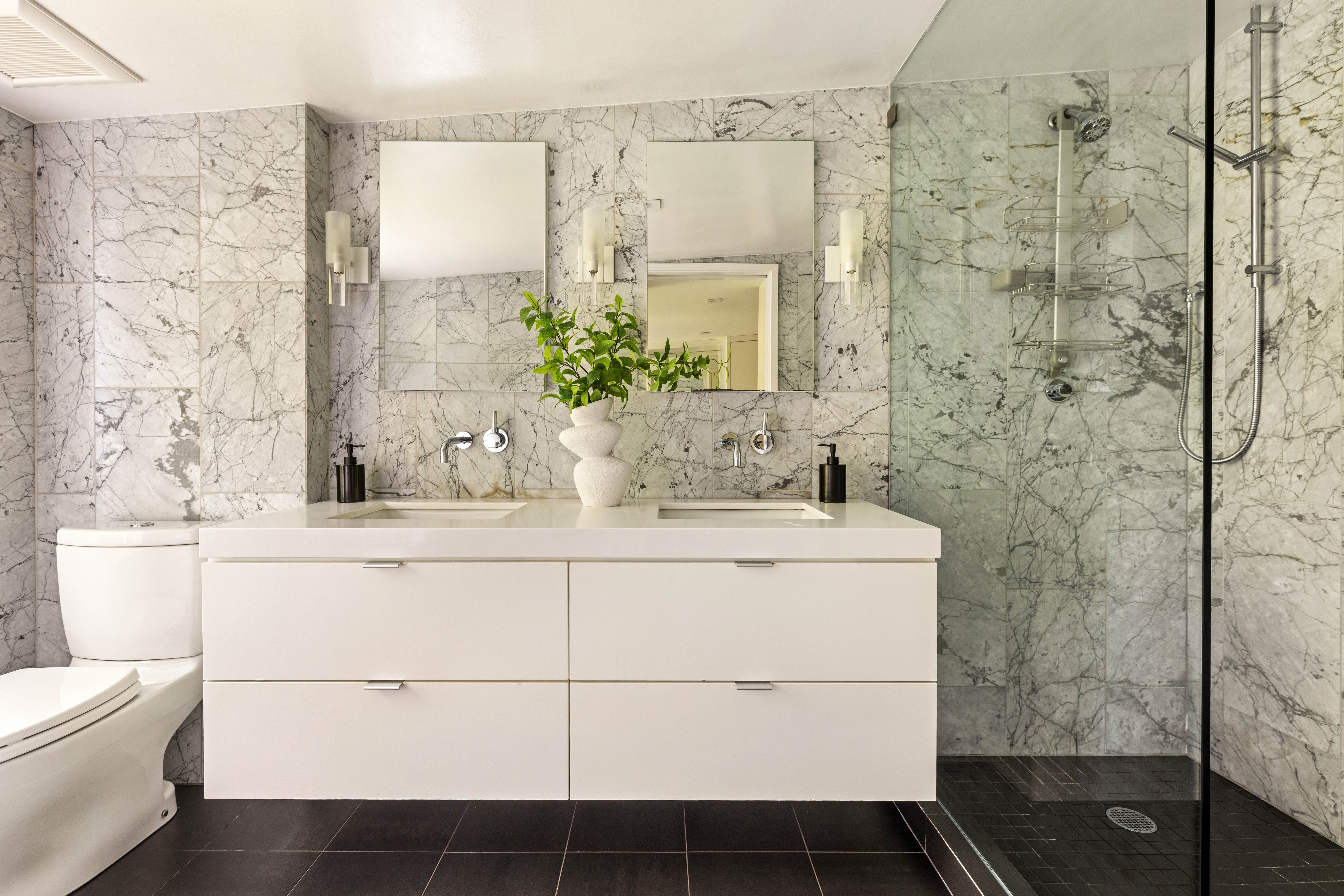 229 Dean Street Brooklyn, NY 11217 - Photo 14 of 23 a bathroom with a granite countertop sink a toilet and shower