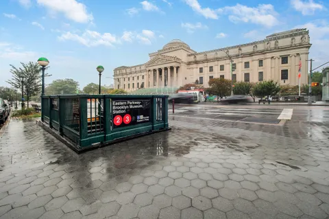 a view of a street with sitting area