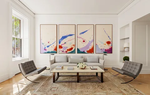 a living room with furniture and painting on the wall