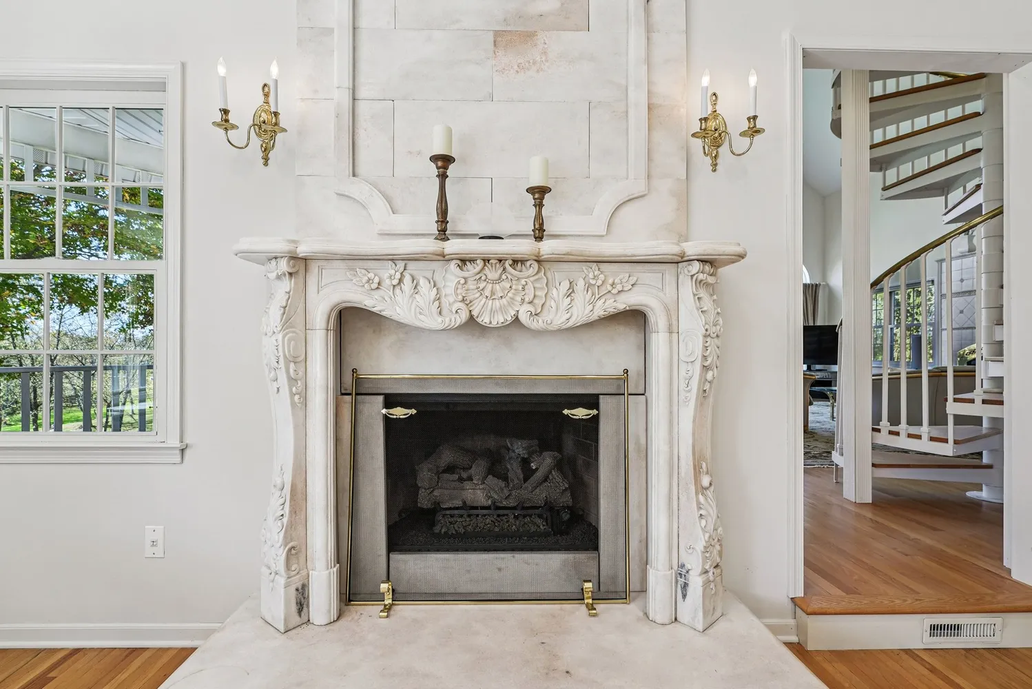 a fireplace with a clock on top of it