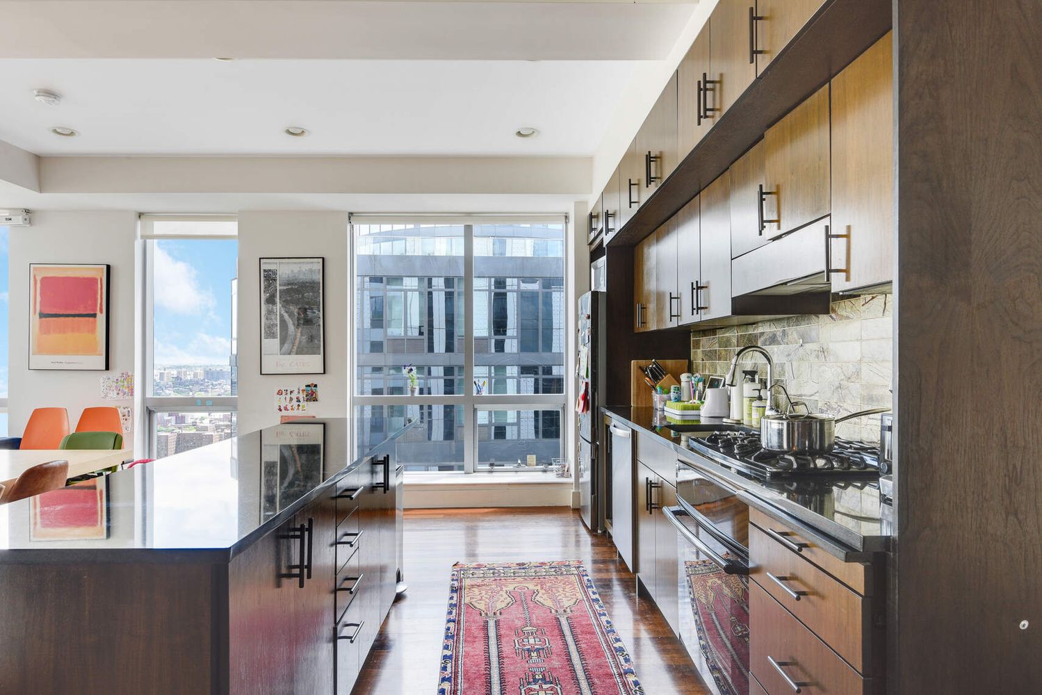 150 Myrtle Avenue, Unit PH3201 Brooklyn, NY 11201 - Photo 10 of 40 a kitchen with stainless steel appliances granite countertop lots of counter top space and wooden floor