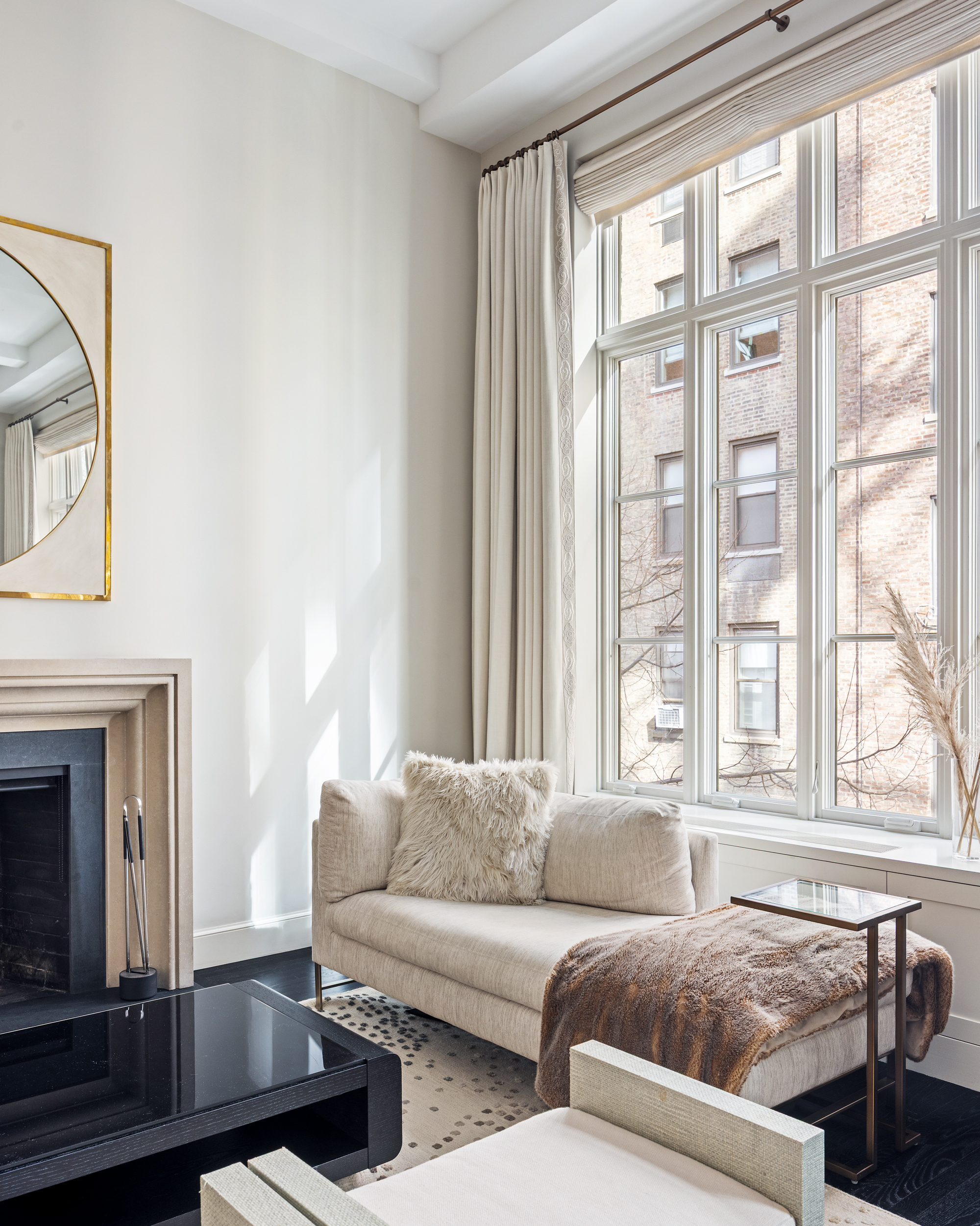 169 East 78th Street, Unit 7C Manhattan, NY 10075 - Photo 13 of 30 a living room with furniture and a large window