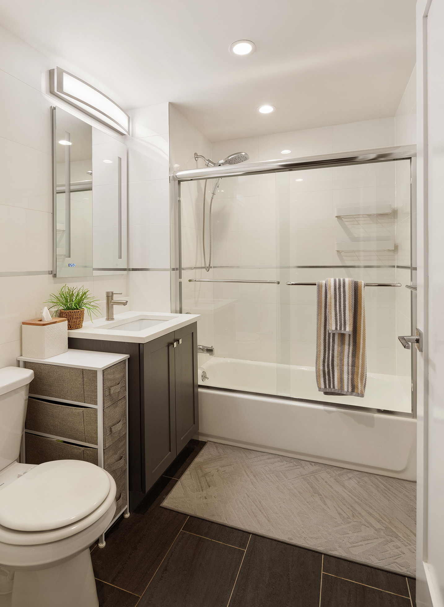 31-22 29th Street, Unit 4A Queens, NY 11106 - Photo 8 of 12 a bathroom with a sink toilet and shower