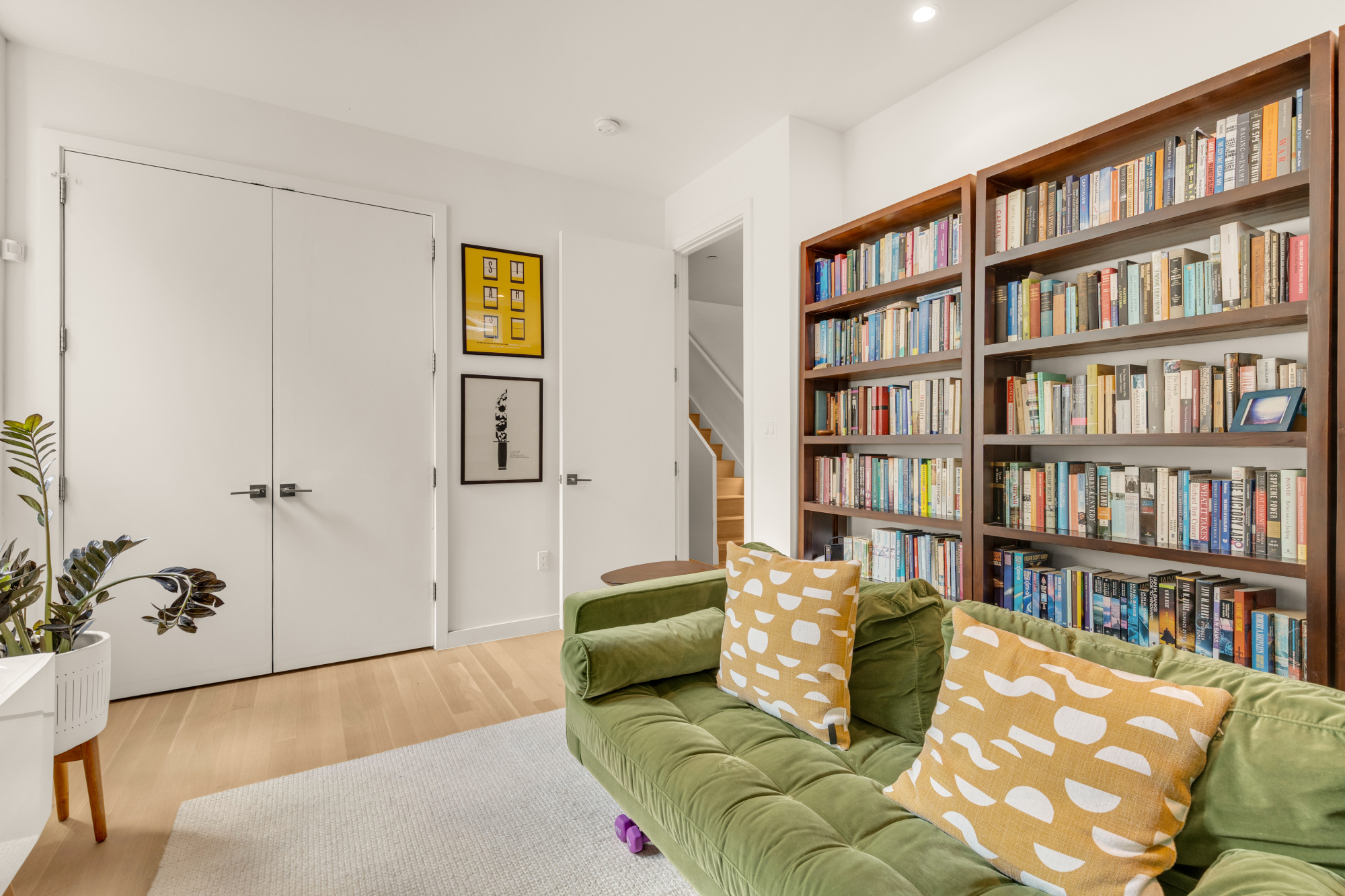 1501 4th Street Northwest, Unit 1 Washington, DC 20001 - Photo 35 of 41 a living room with furniture and book shelf