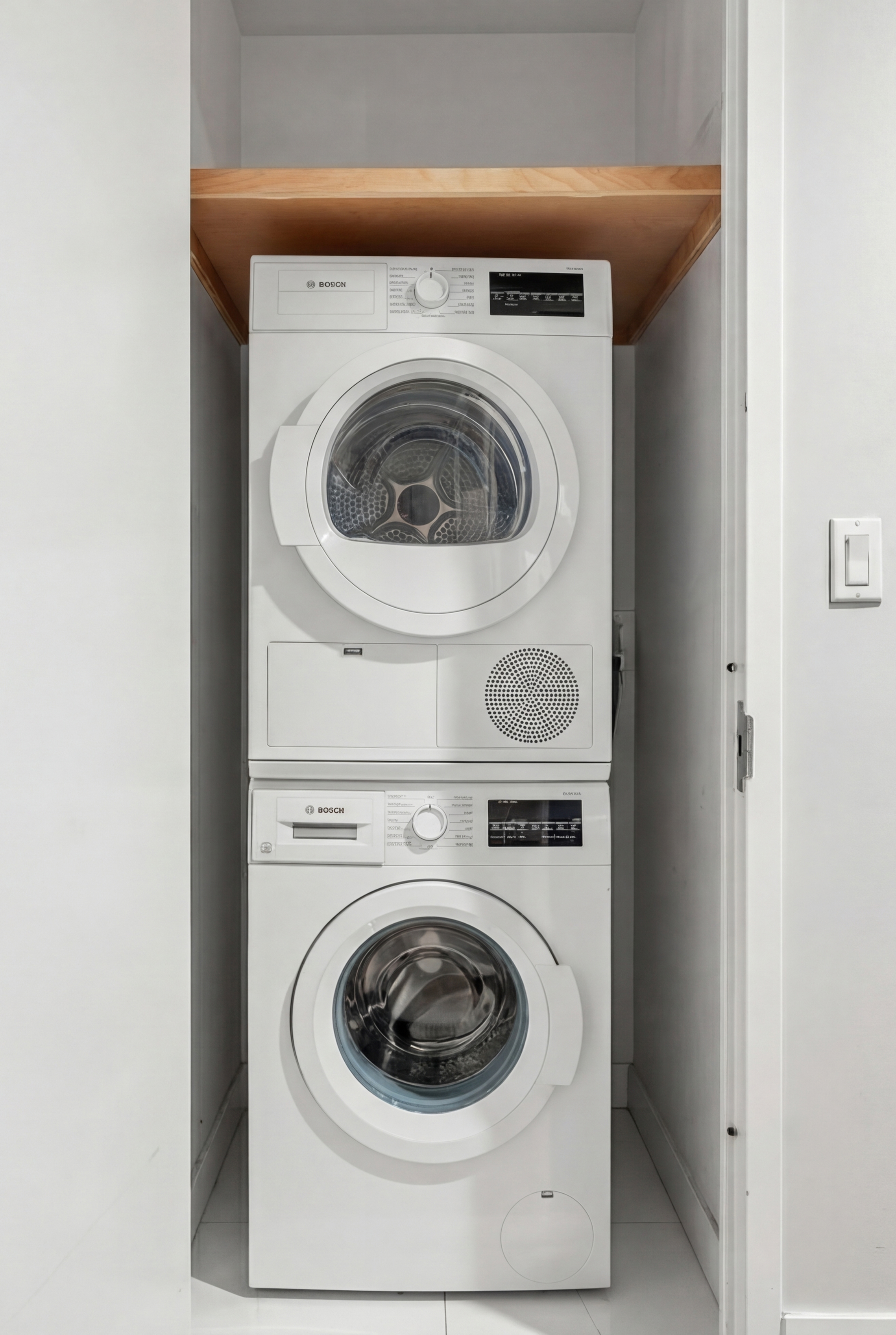 117 West 123rd Street, Unit 1B Manhattan, NY 10027 - Photo 16 of 25 a utility room with dryer and washer
