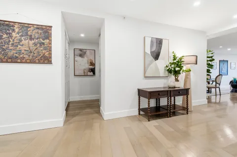a view of a livingroom with furniture and a potted plant