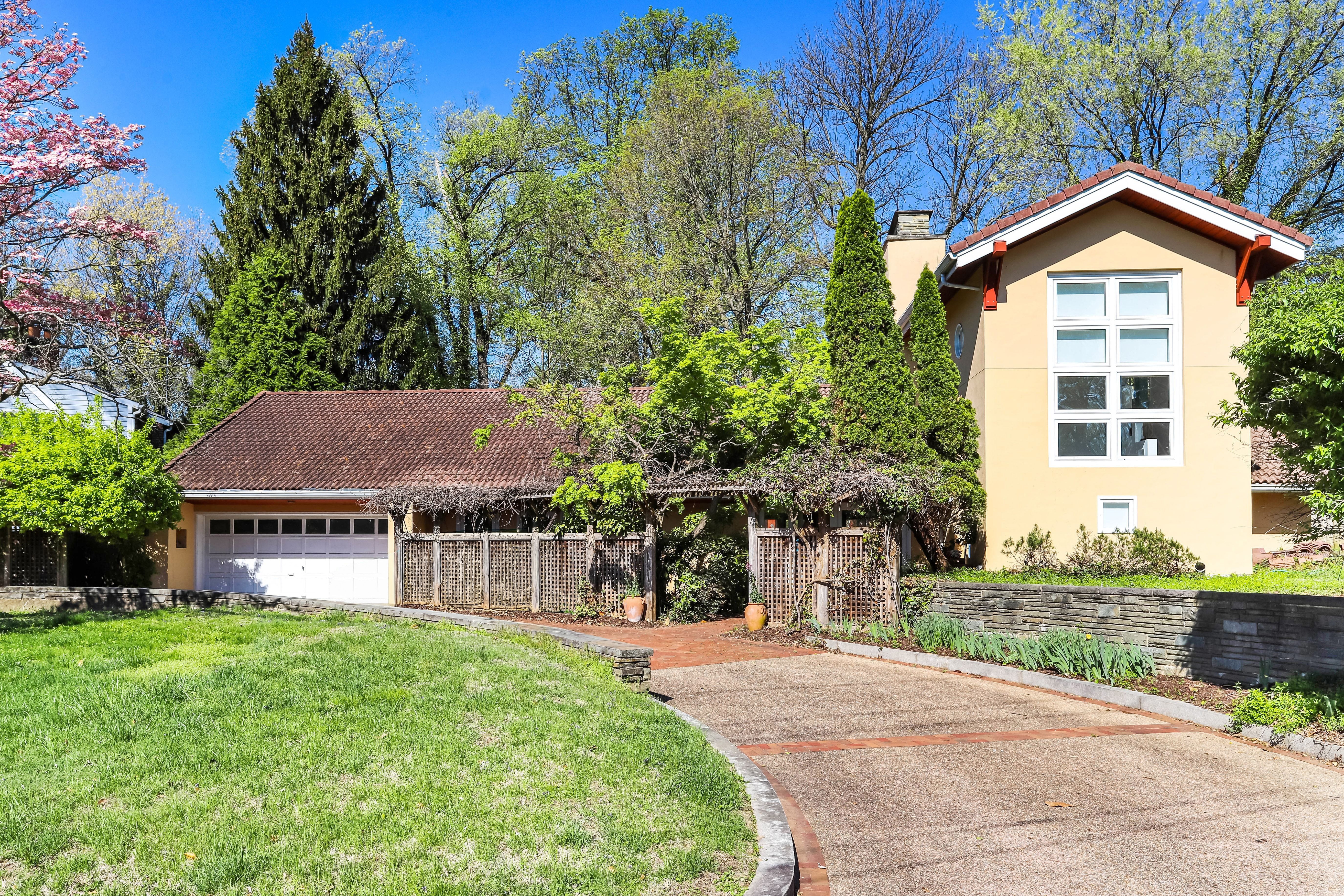 7903 Curtis Street Chevy Chase, MD 20815 - Photo 2 of 49 a front view of a house with a yard and garage