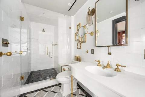 a living room with furniture a window and a flat screen tv