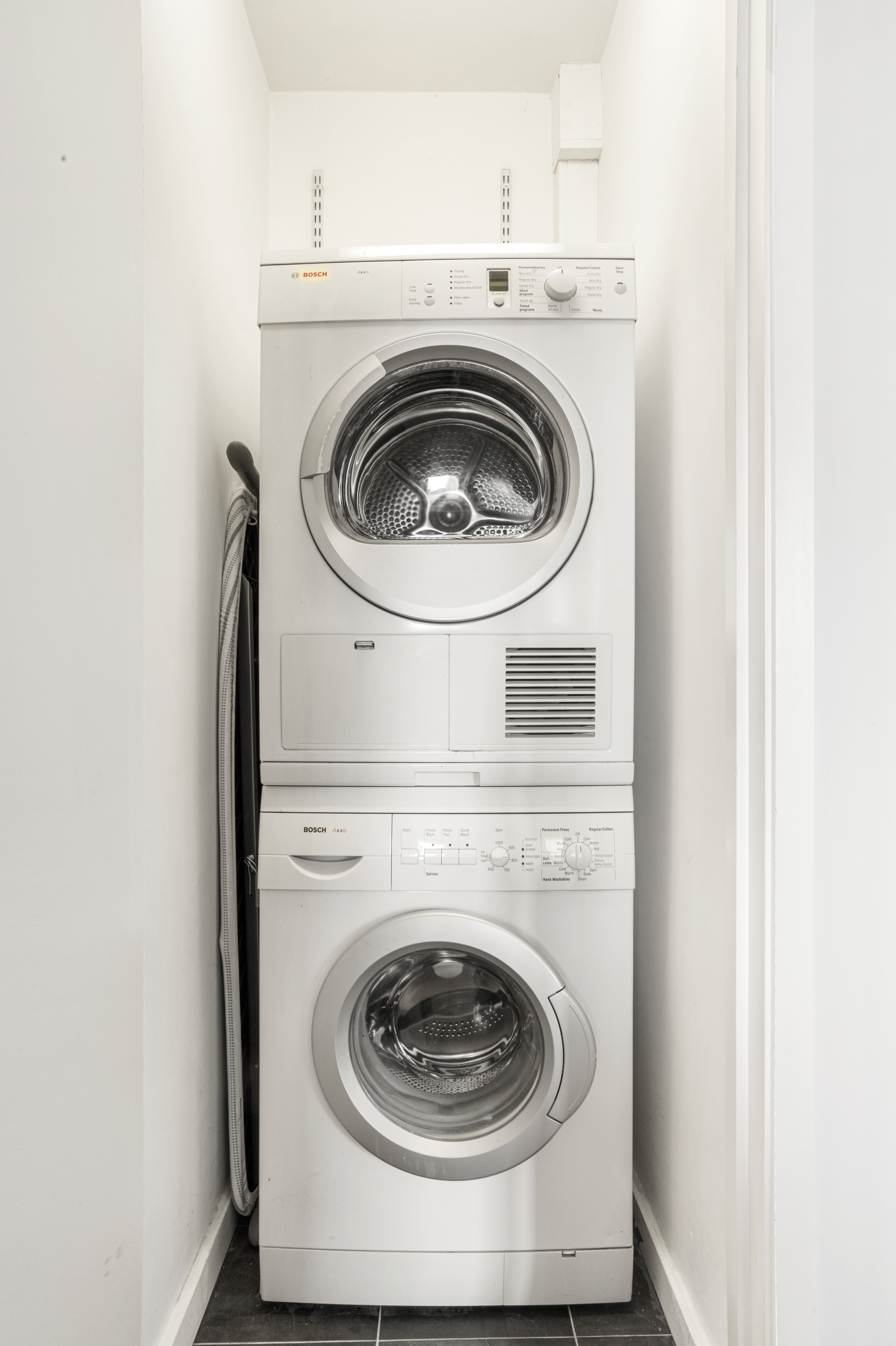 515 East 72nd Street, Unit 25E Manhattan, NY 10021 - Photo 8 of 11 a utility room with dryer and washer