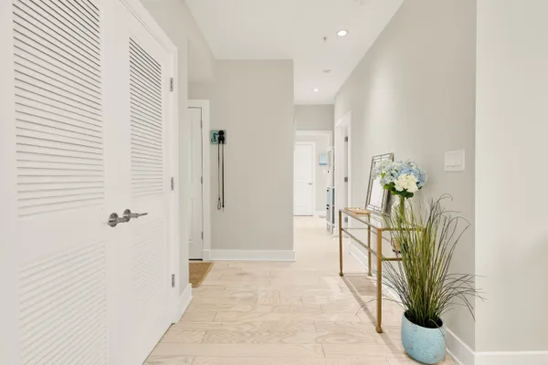 a view of a hallway with washer and dryer