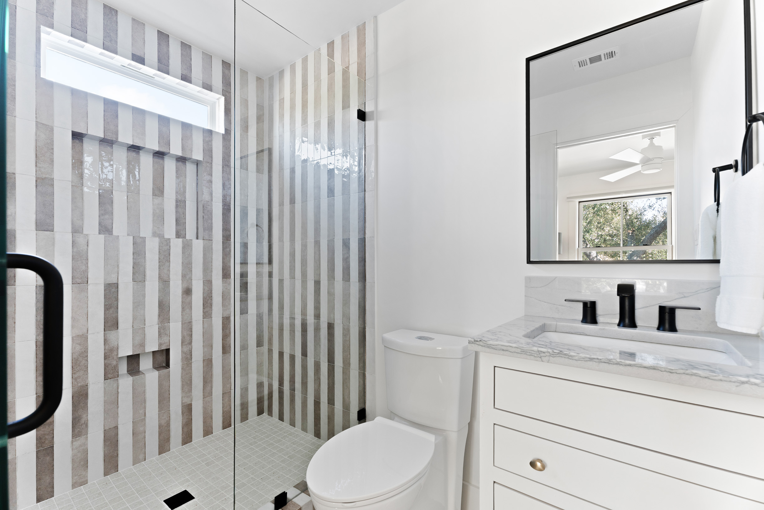 1317 Thaddeus Cove Austin, TX 78746 - Photo 16 of 22 a bathroom with a sink toilet and shower