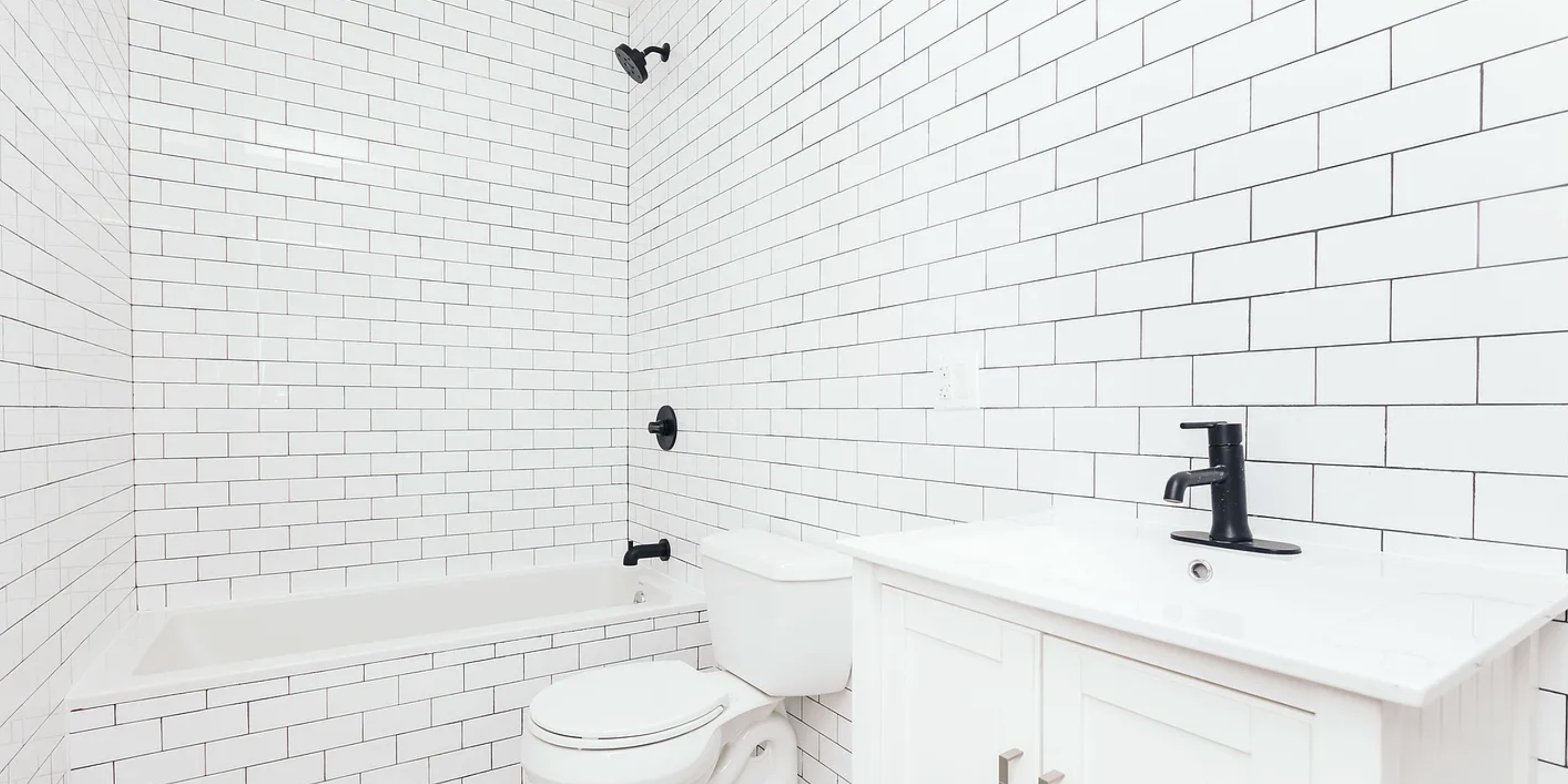 131 North 5th Street, Unit 4 Brooklyn, NY 11249 - Photo 6 of 6 a bathroom with a sink a toilet and bathtub