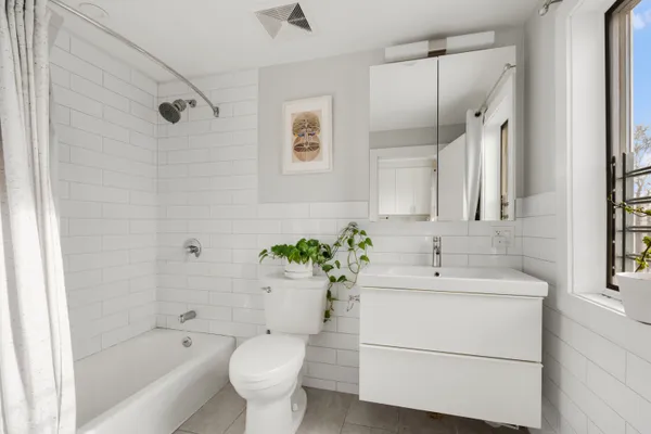 a bathroom with a sink toilet and bathtub