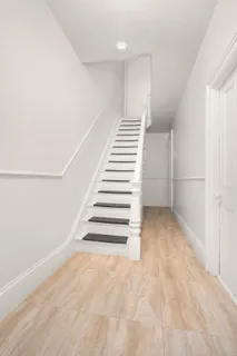a view of an empty room with stairs
