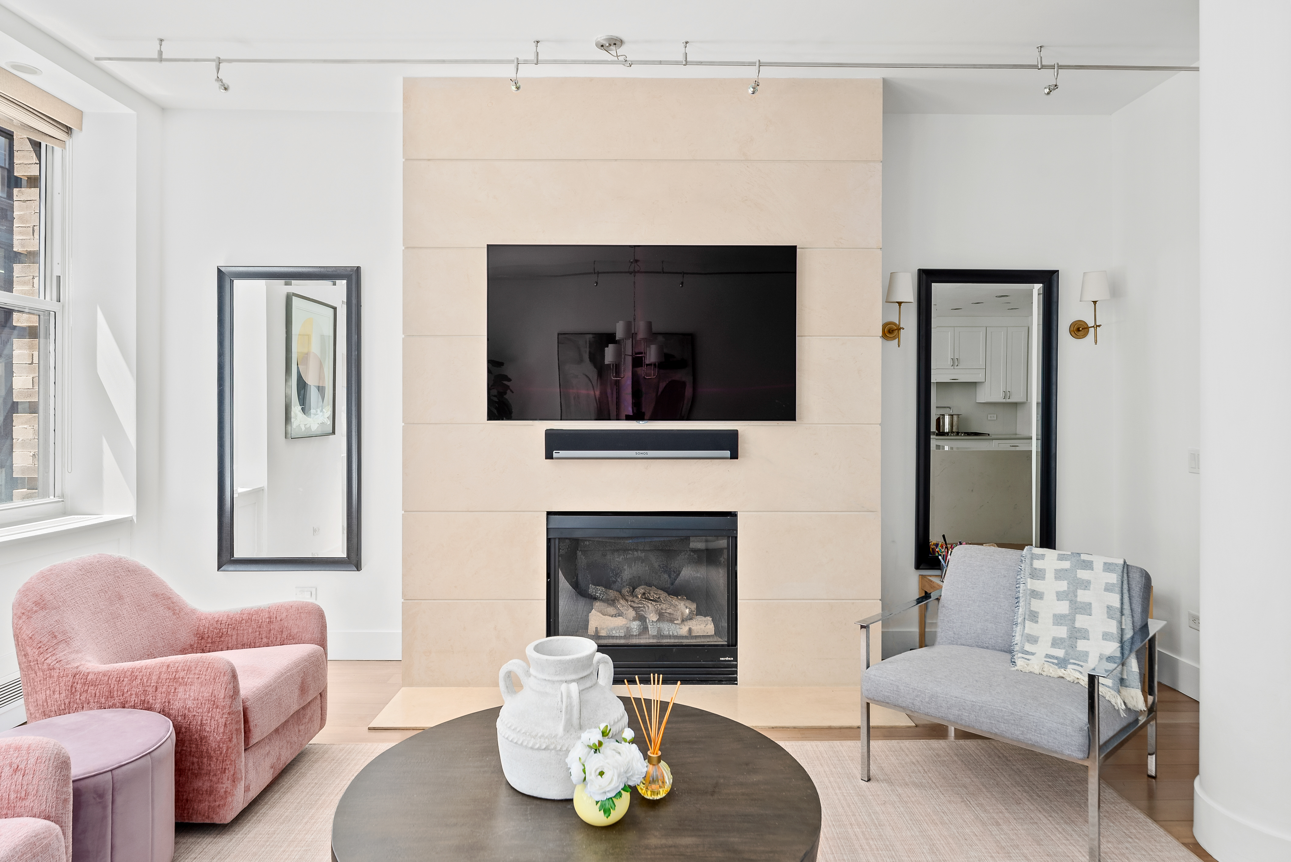 15 West 20th Street, Unit 9A Manhattan, NY 10011 - Photo 5 of 21 a living room with furniture and a fireplace