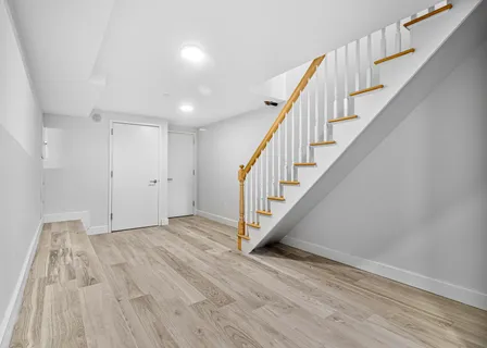 a view of entryway with wooden floor