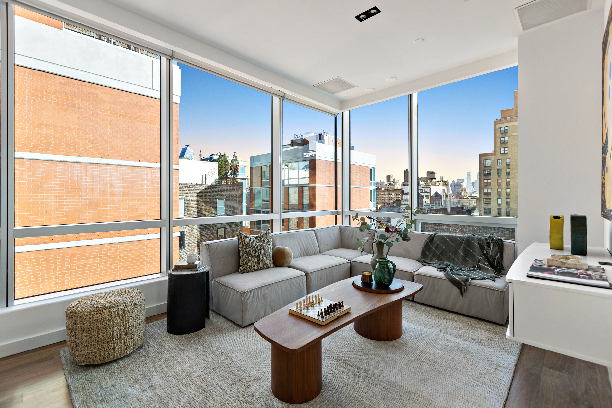 166 West 18th Street, Unit PH11 Manhattan, NY 10011 - Photo 8 of 16 a living room with furniture and a large window